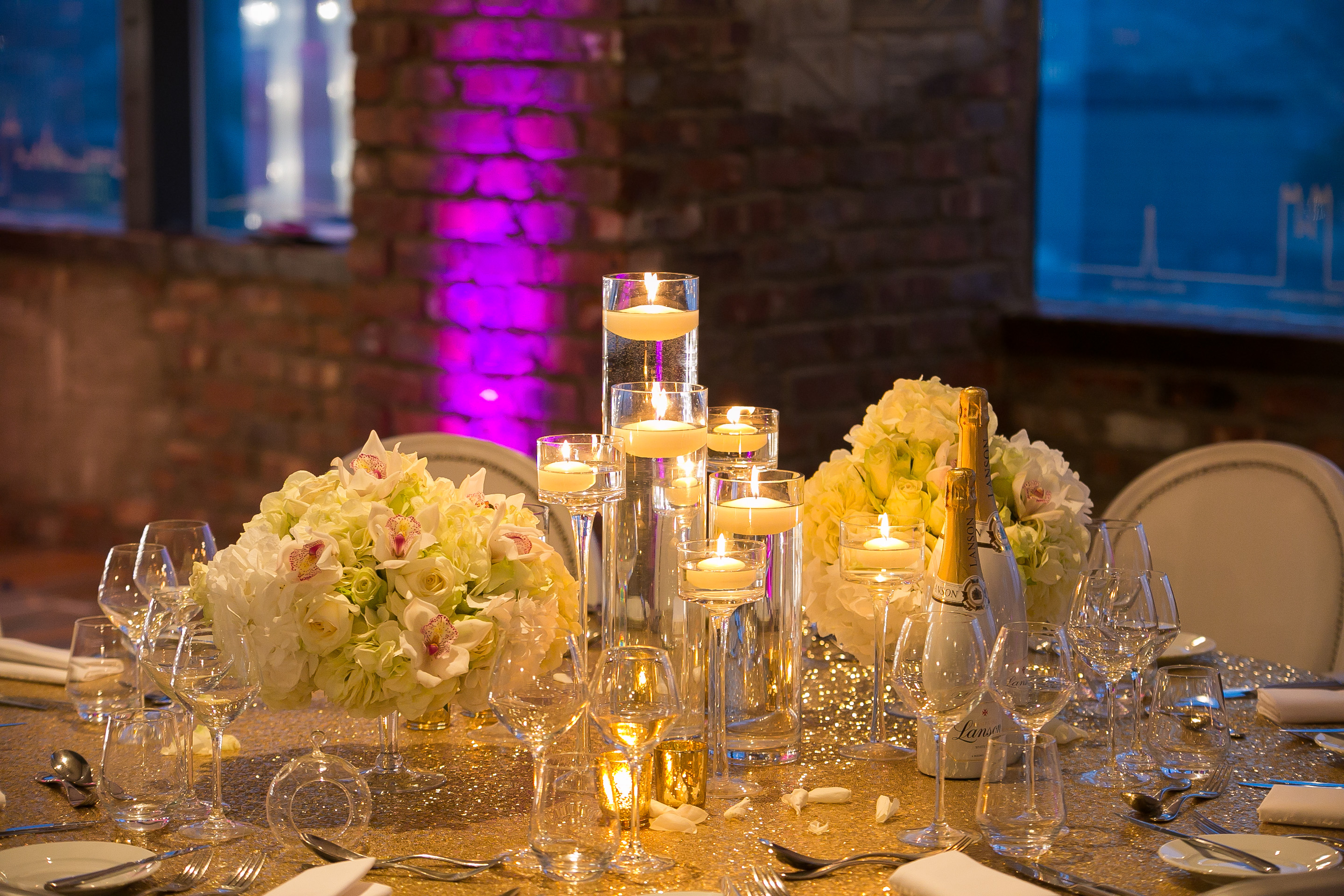 Elegant table setting with floral arrangements for weddings or corporate events in Altitude London.
