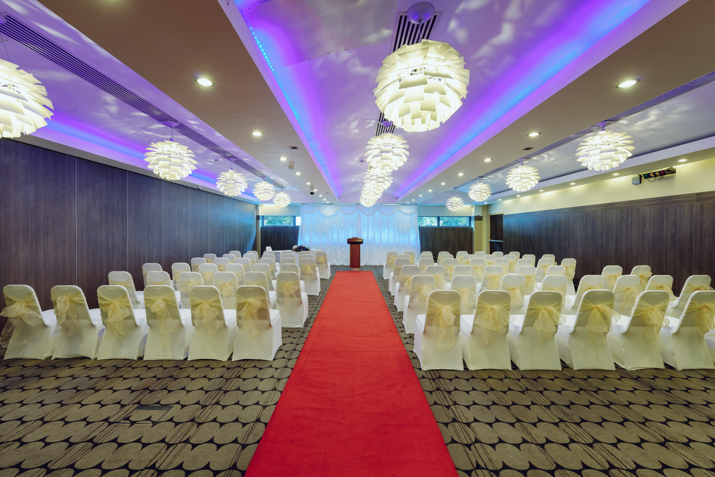 Kingston Suite at Crowne Plaza: elegant event space with red carpet, ideal for conferences.