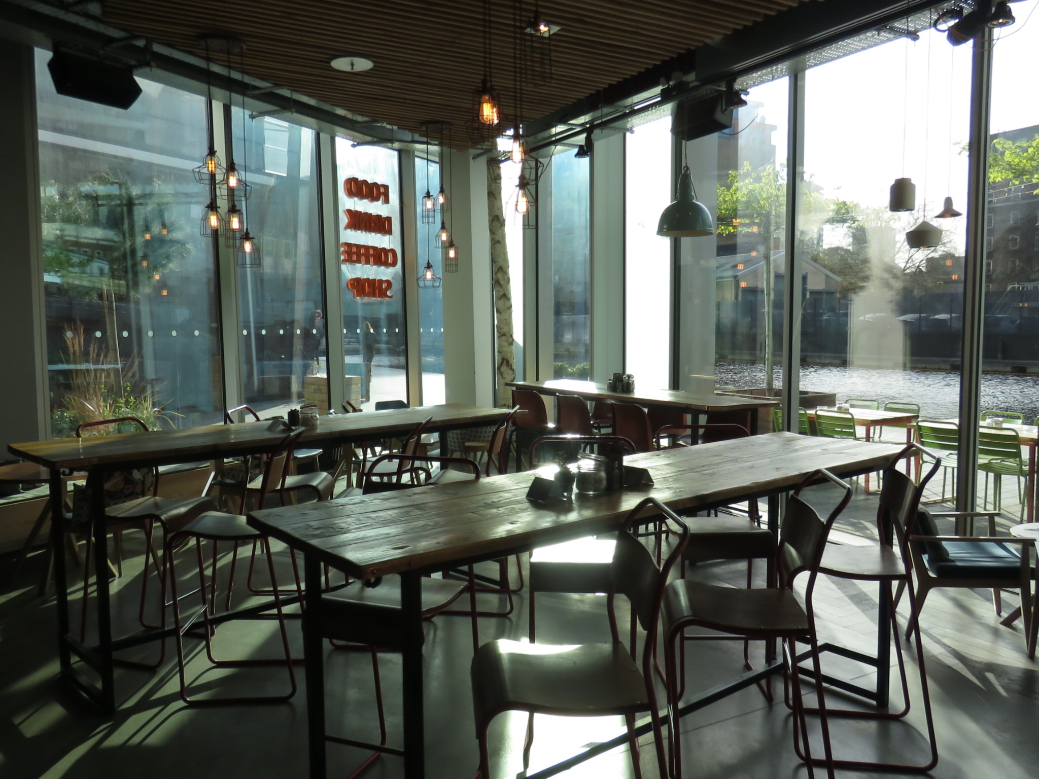 Modern event space at KuPP with large windows, ideal for networking and meetings.