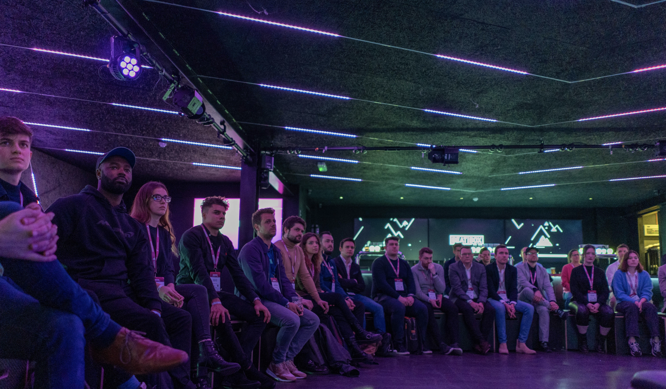 Panel discussion at BeatBox, Boxpark Wembley with engaged audience in modern venue.