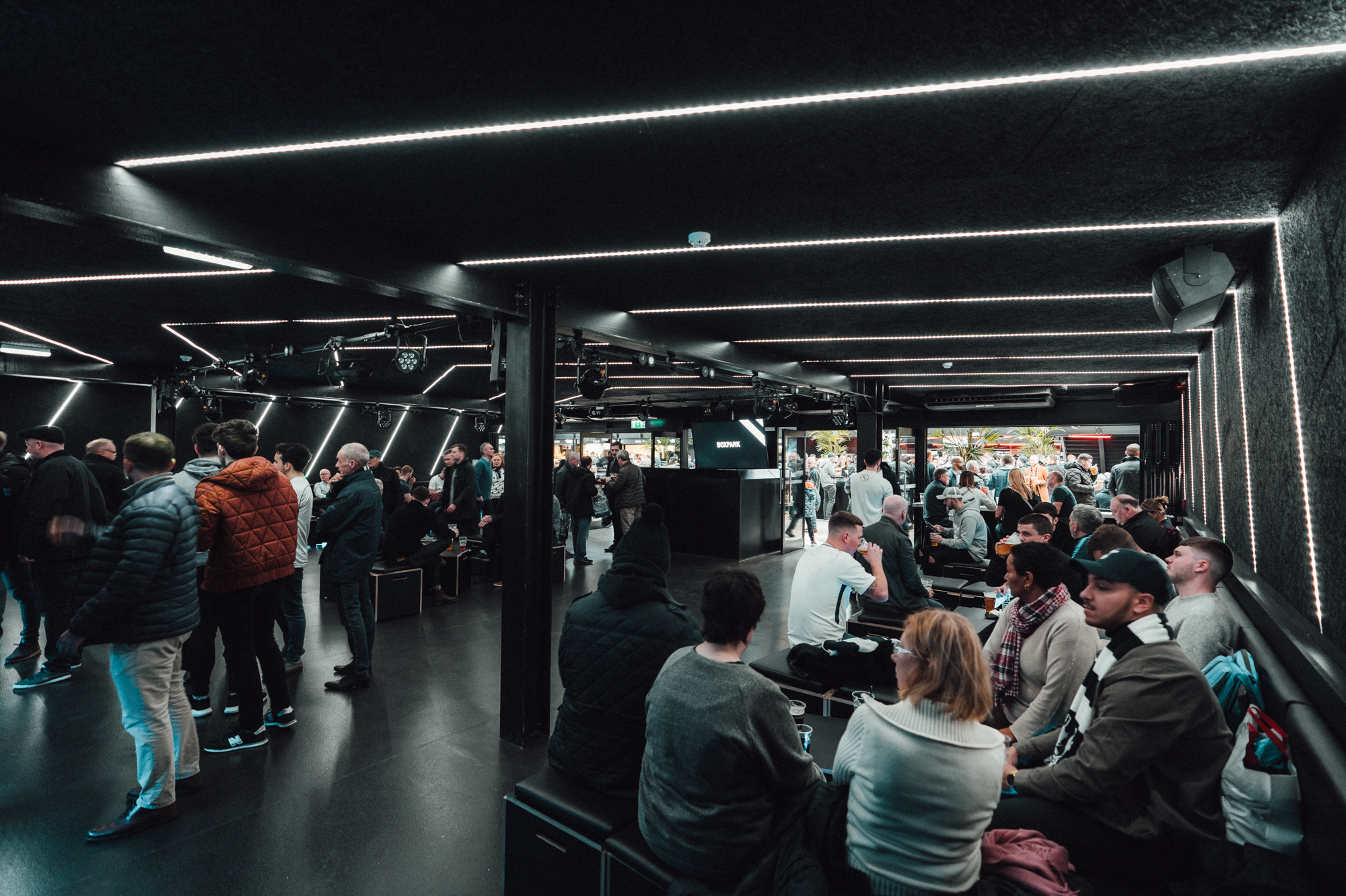 BeatBox at Boxpark Wembley: modern event space with dynamic lighting for networking.