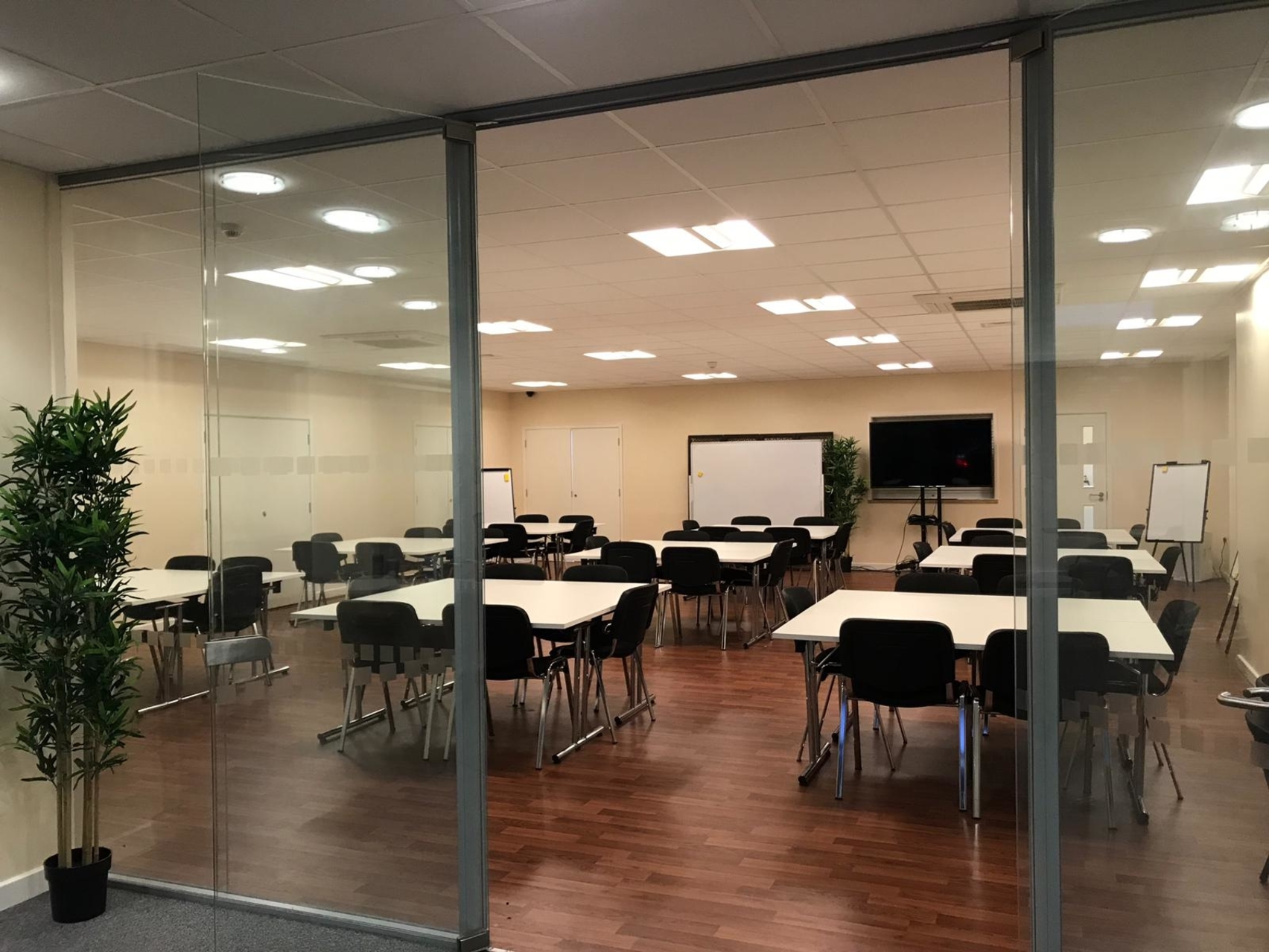 Versatile meeting room in Whitechapel, London, ideal for presentations and collaboration.