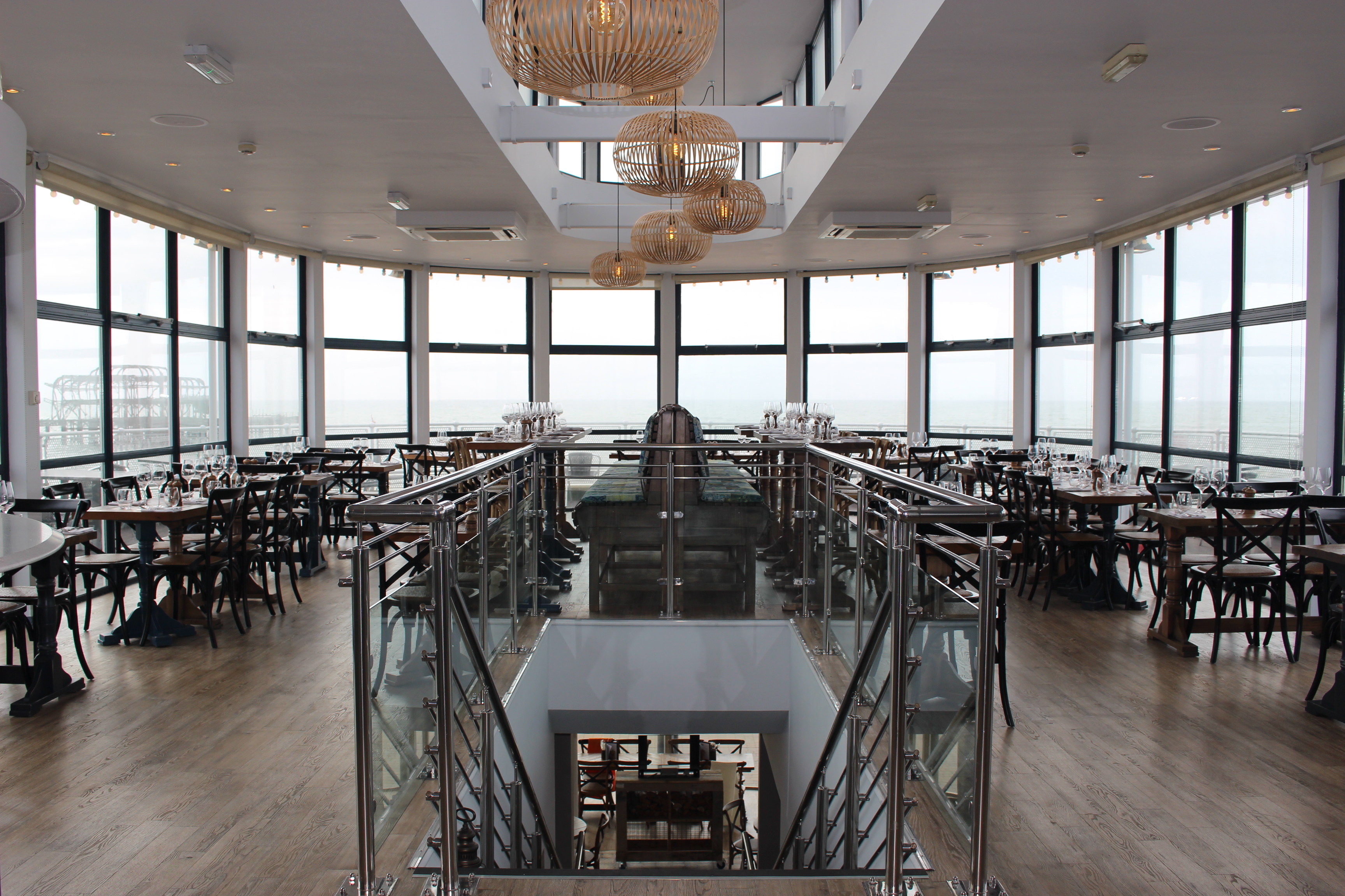 Modern Brighton Beach Club restaurant with panoramic windows, ideal for events and dining.