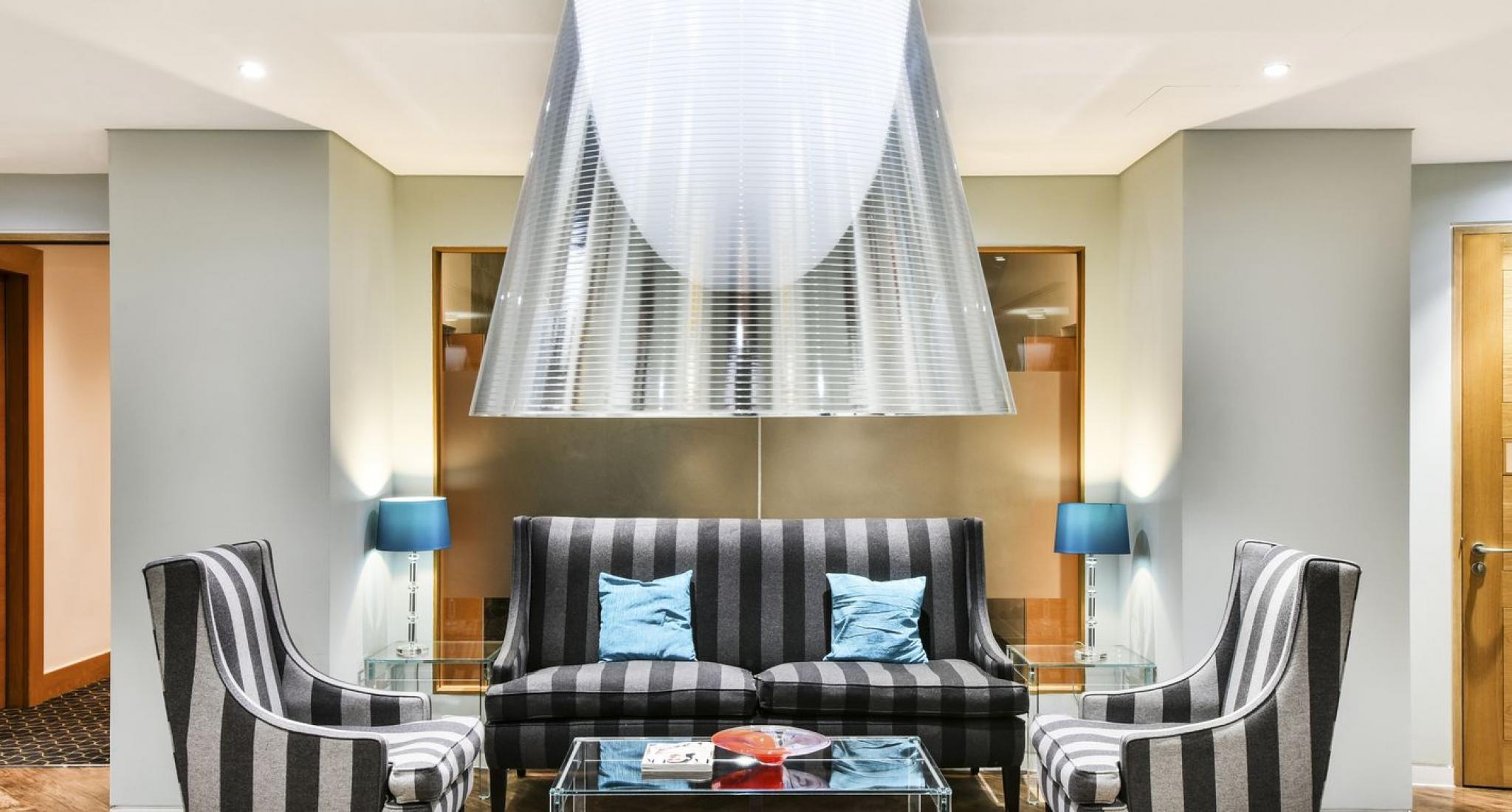 Stylish purple lounge with striped furniture for networking events at 1 Cornhill.