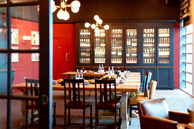 Stylish meeting room with wooden table, ideal for corporate gatherings at The Bull Westfield.