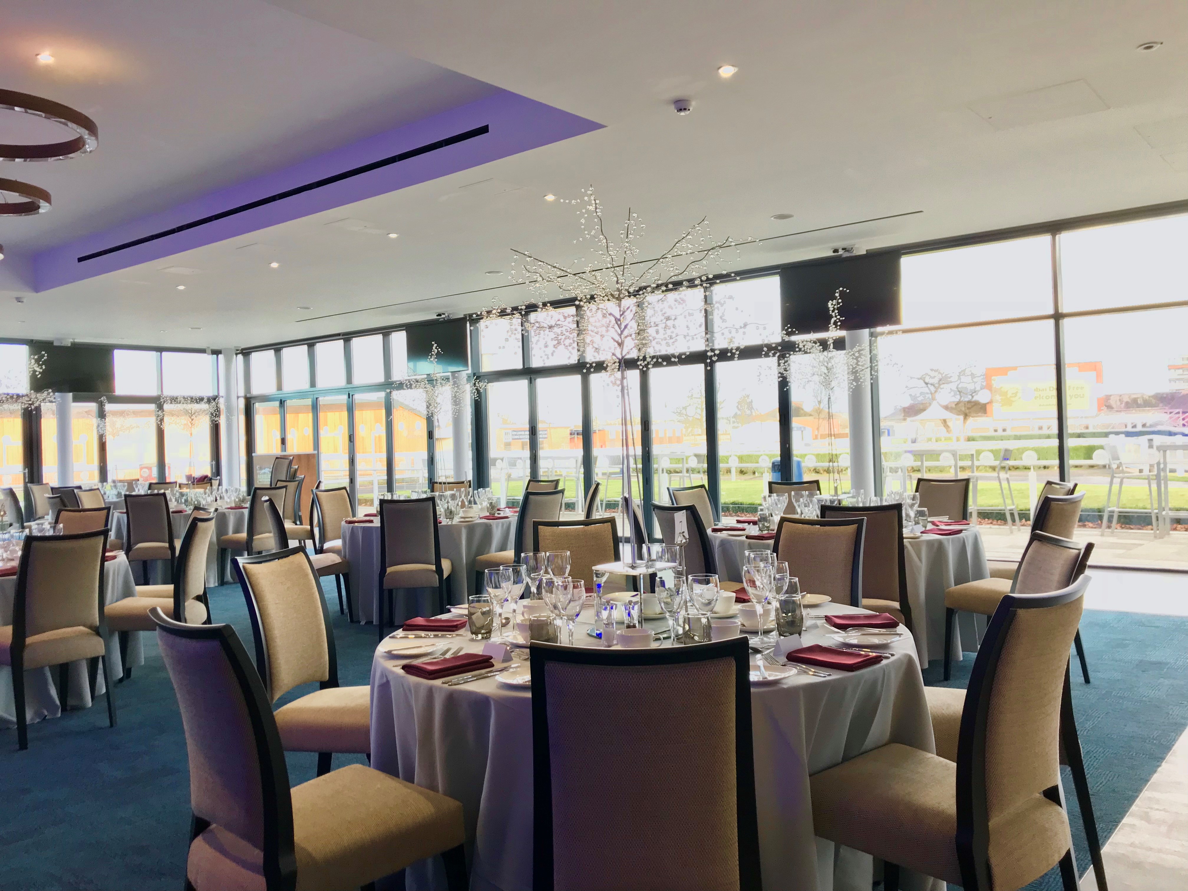 Elegant dining area at The Owners Club, Newbury Racecourse for corporate events and gatherings.