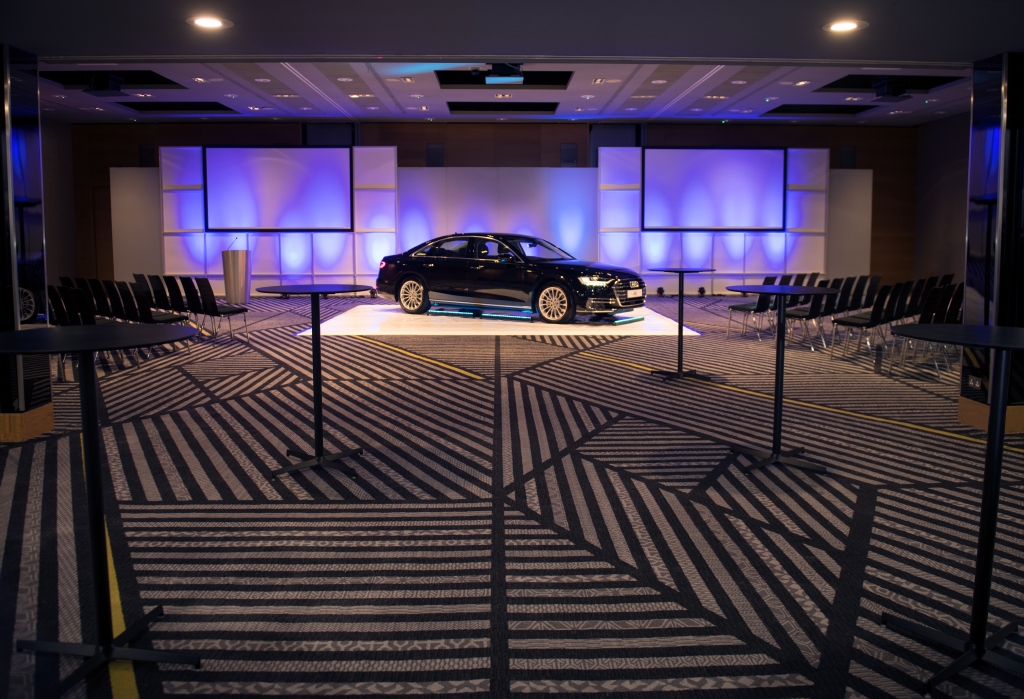Essex Suite at Radisson Blu: sleek car on stage for product launch event.