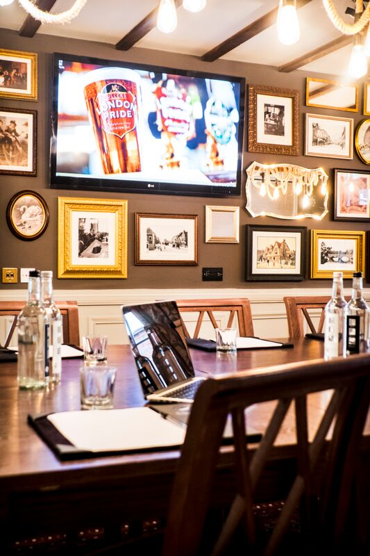 Elegant meeting room at White Swan Hotel with chandelier, perfect for professional gatherings.