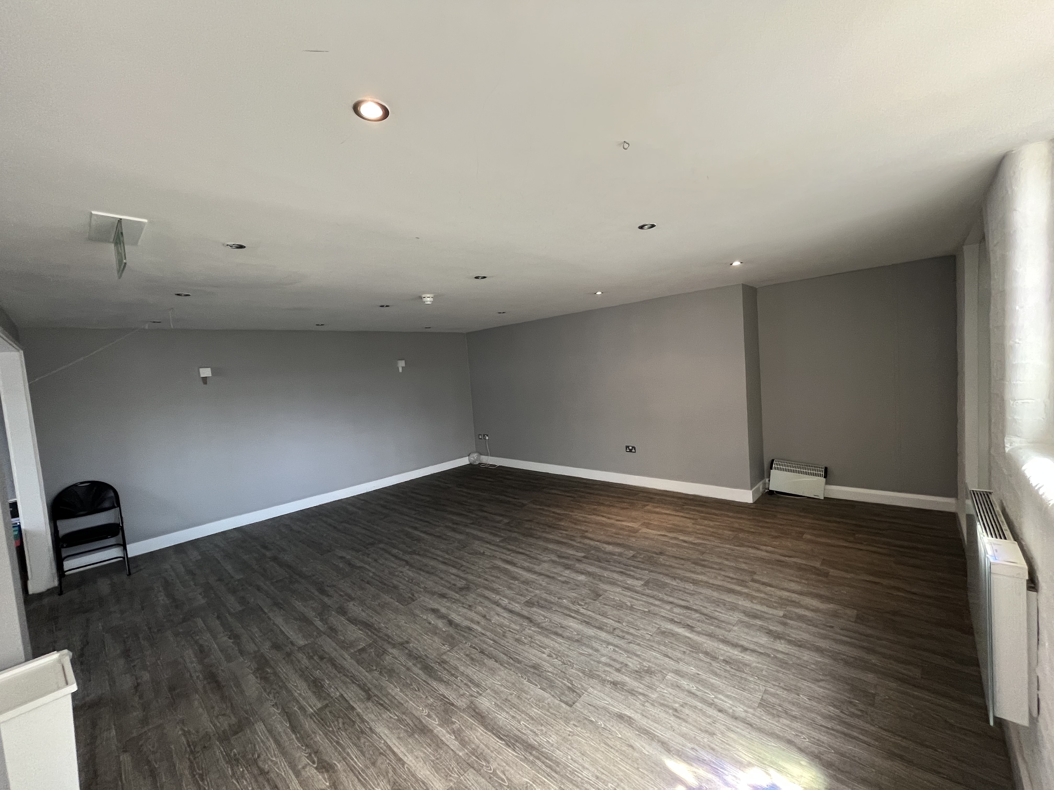 Versatile studio space with gray walls for meetings and events in The Engine Room, NW1.