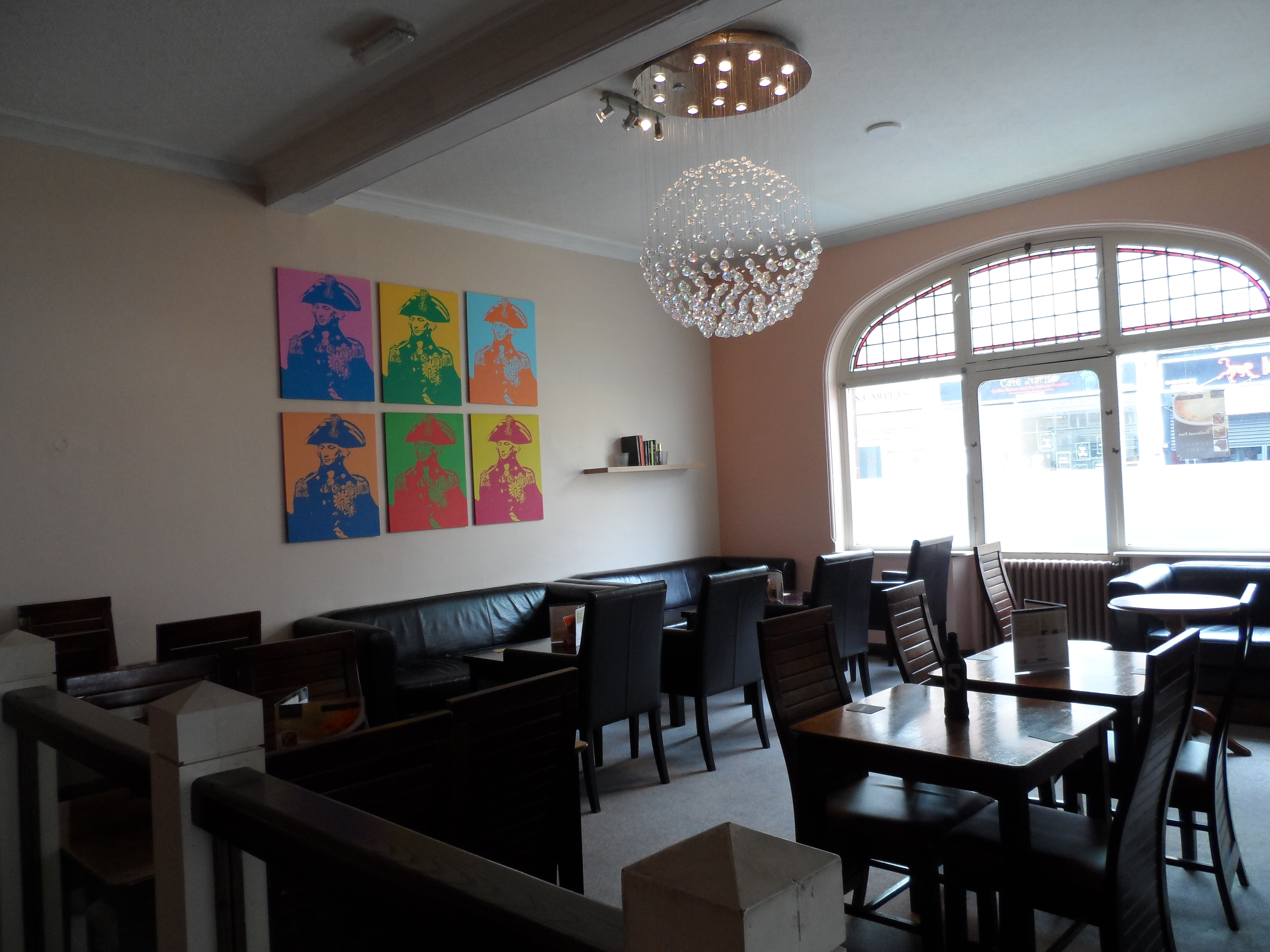 Modern event space at The Nelson Arms with vibrant artwork, ideal for networking.