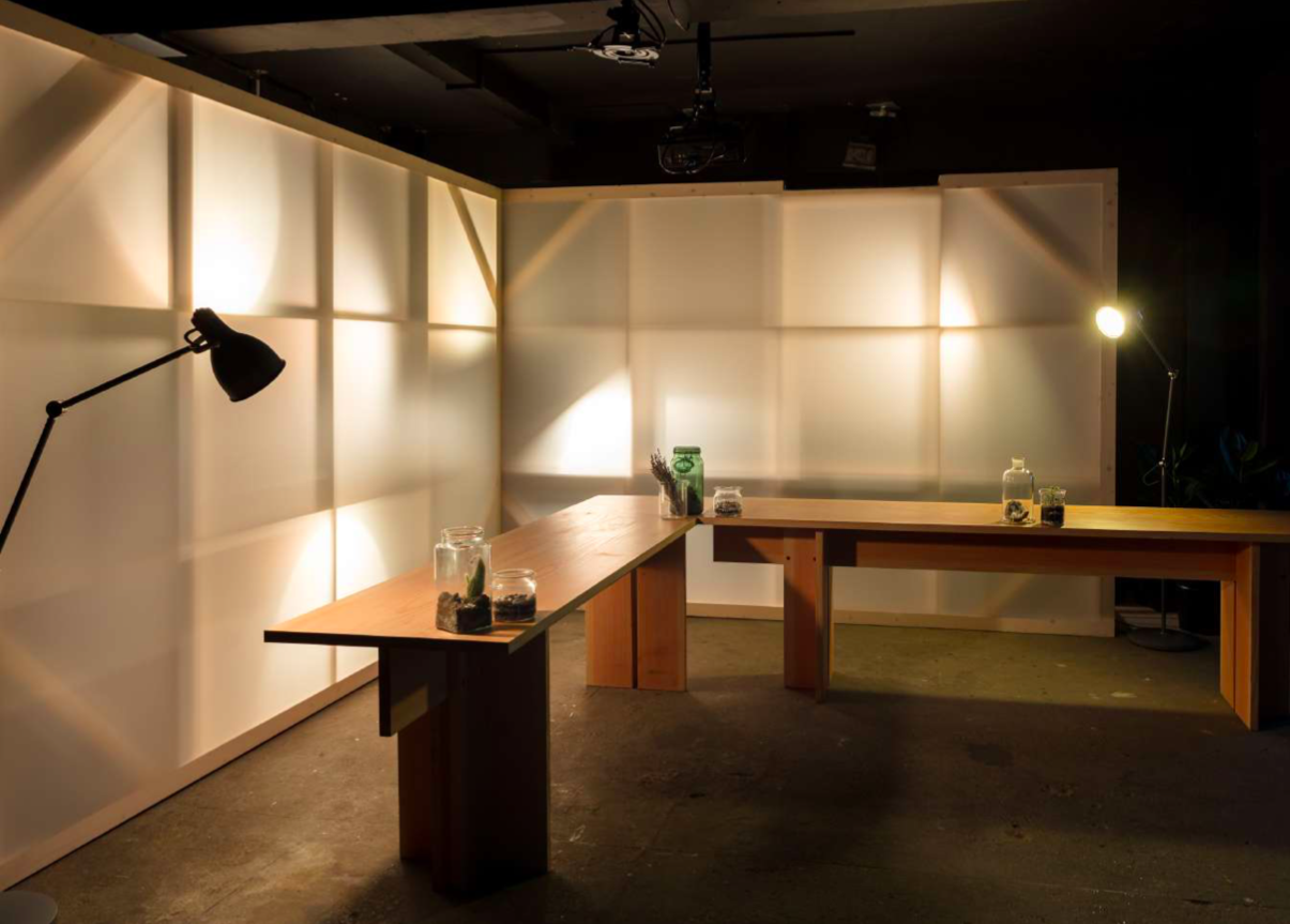 Minimalist meeting space with wooden tables, perfect for workshops and discussions.