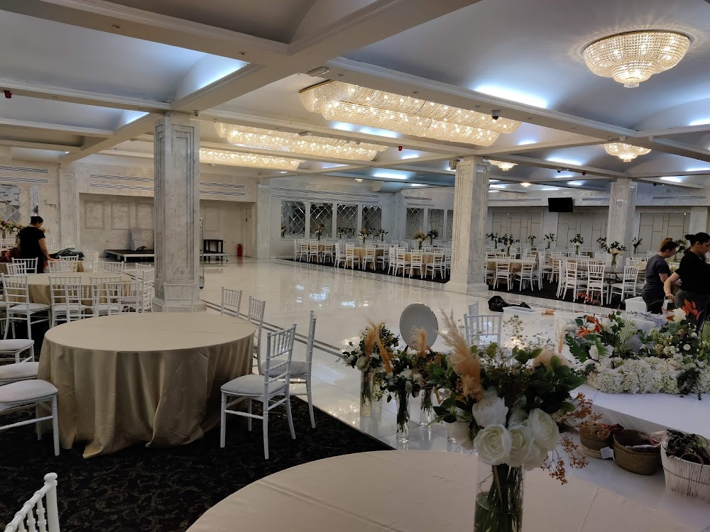 Praba Banqueting Suite ballroom with chandeliers set for a formal gala or wedding banquet.