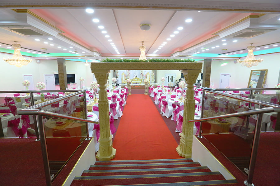 Grand red-carpet banquet hall at Praba Banqueting Suite for formal wedding and corporate events.