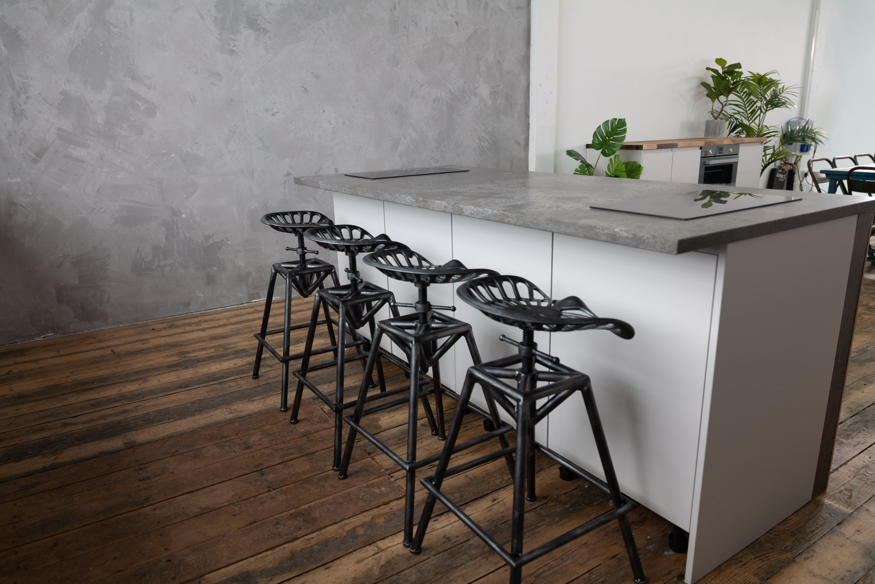 Modern kitchen with concrete countertop for casual networking events at Crixus Studios.