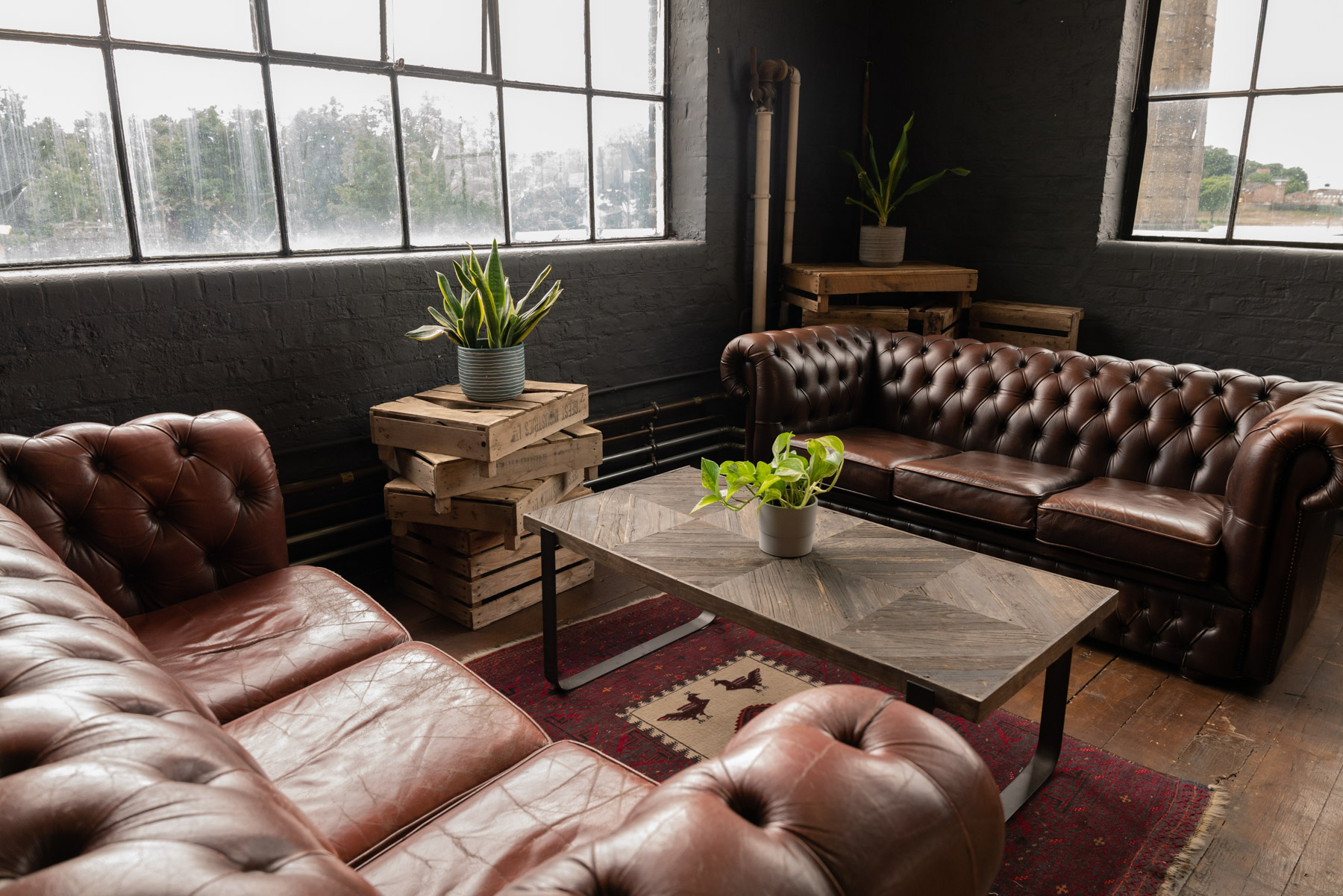 Crixus Dockyard Kitchen lounge with leather sofas for networking events and meetings.