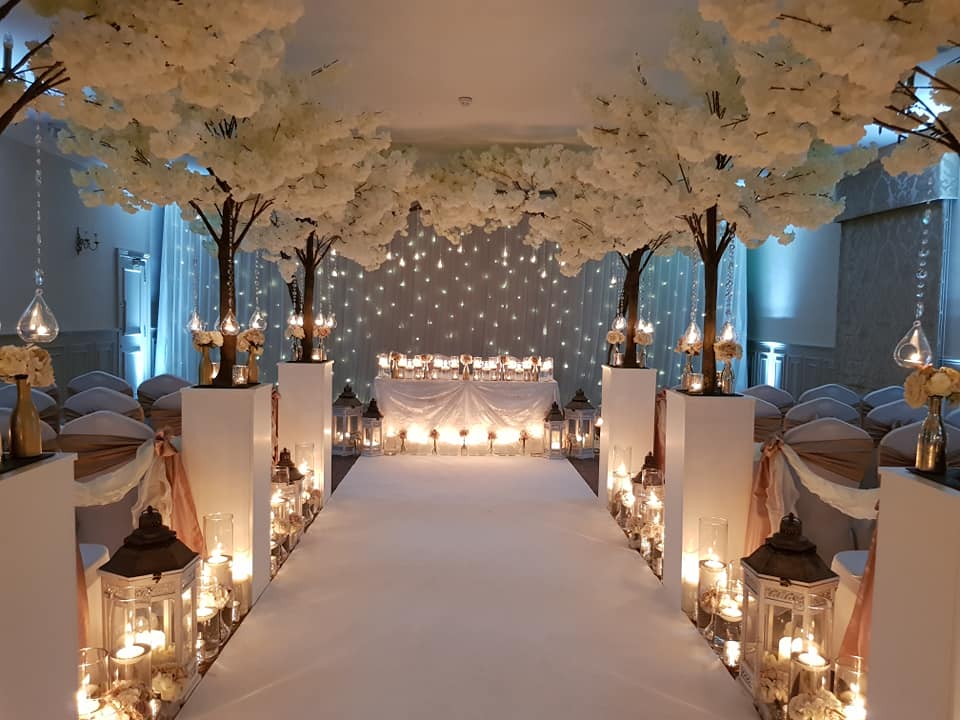 St Andrews Suite at Mottram Hall, elegant wedding venue with floral decor and soft lighting.