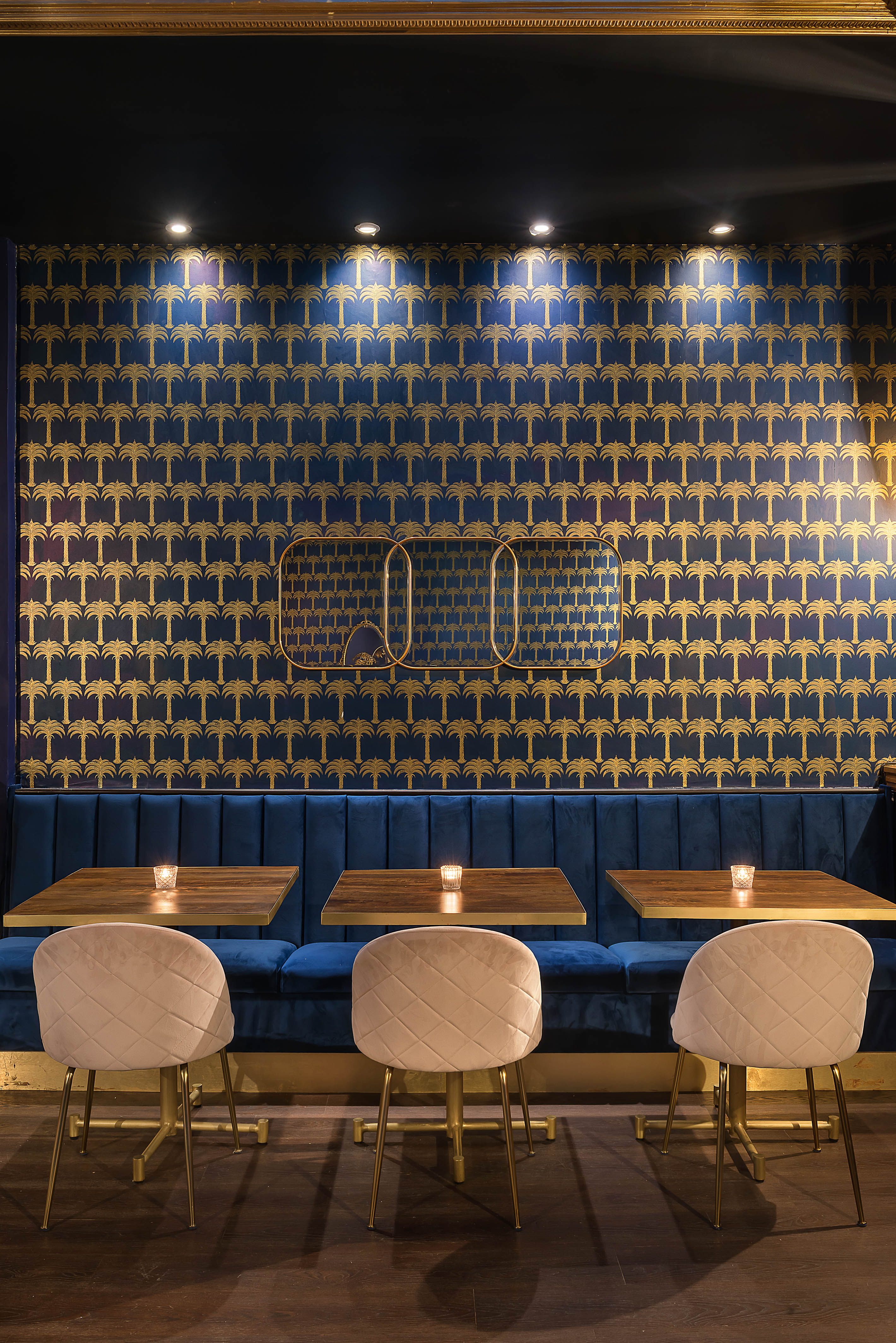Stylish Lounge Bar with patterned wallpaper, perfect for networking events and gatherings.