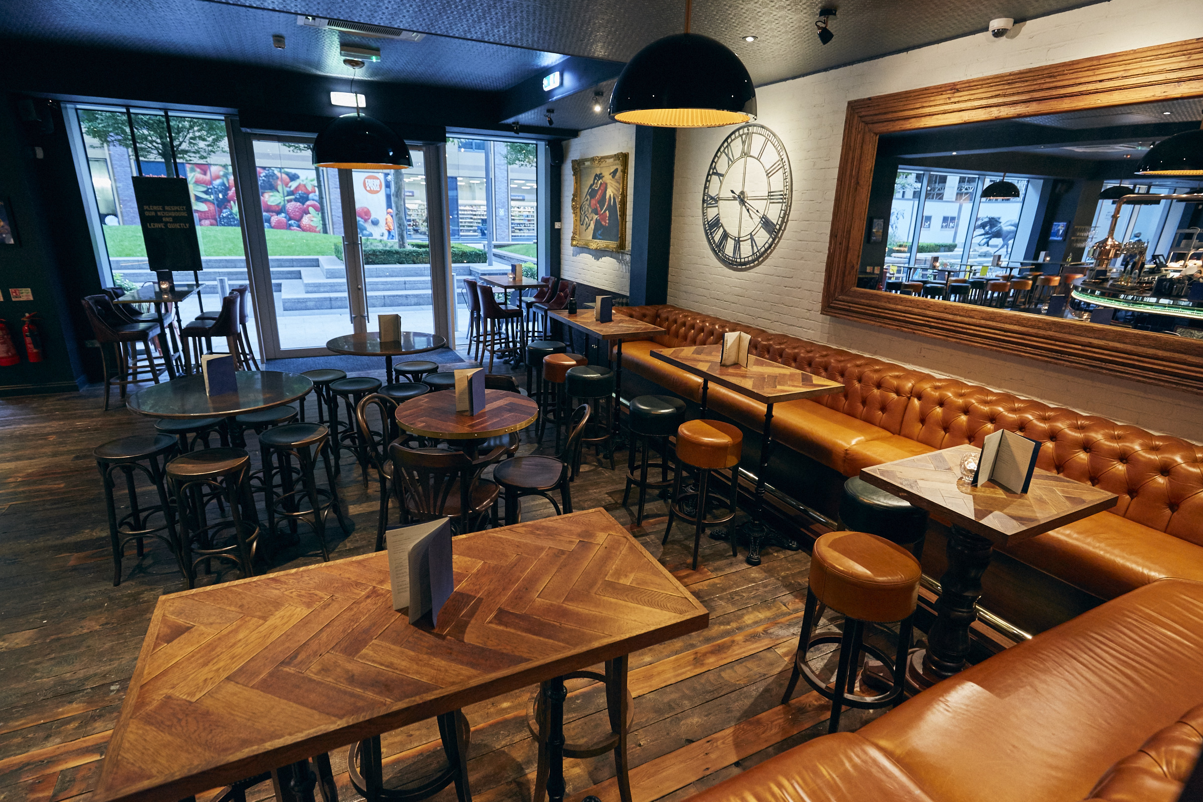 Stylish bar area with warm lighting, perfect for casual meetings and networking events.