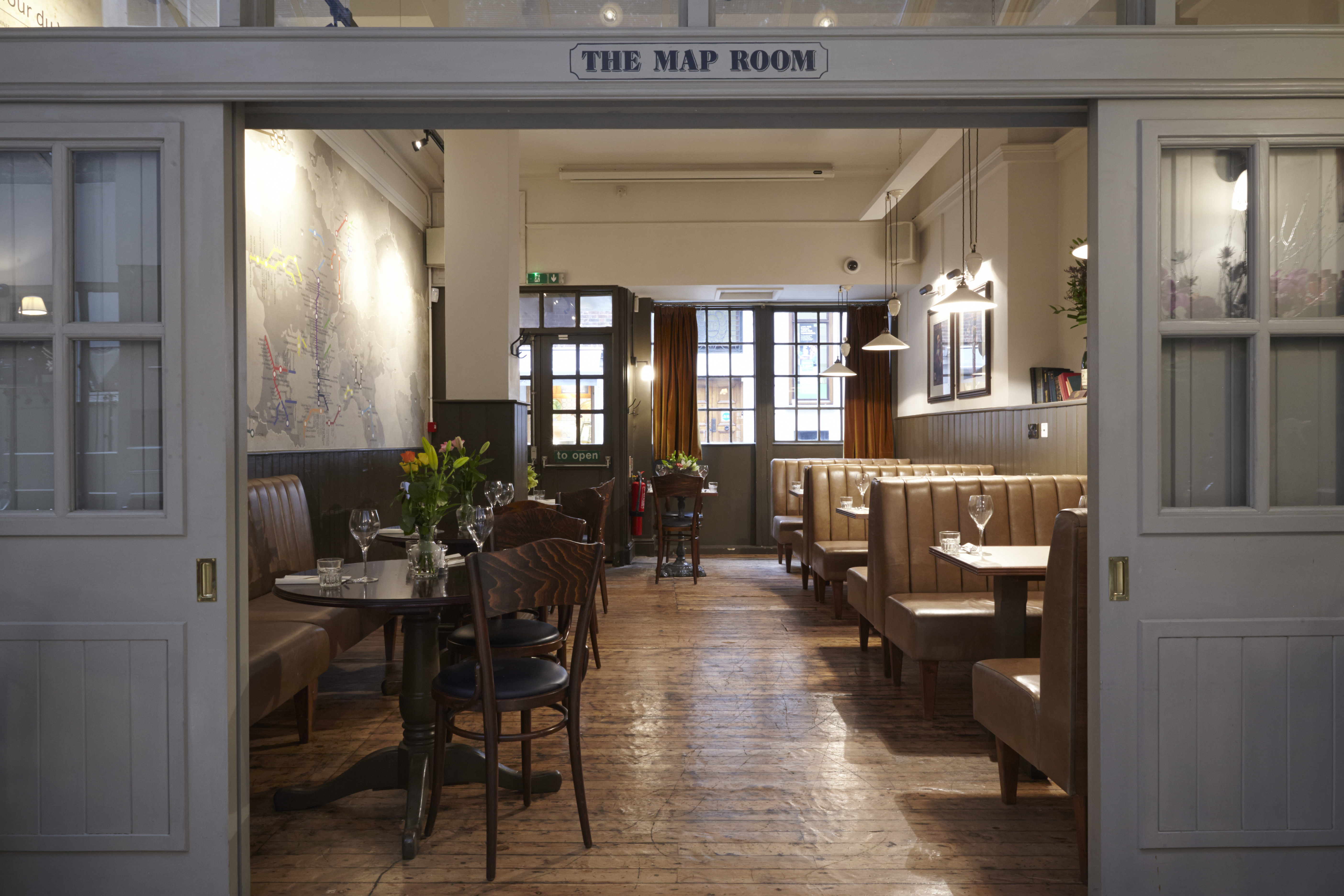 Map Room at Dalys Wine Bar: cozy meeting space for gatherings and networking events.