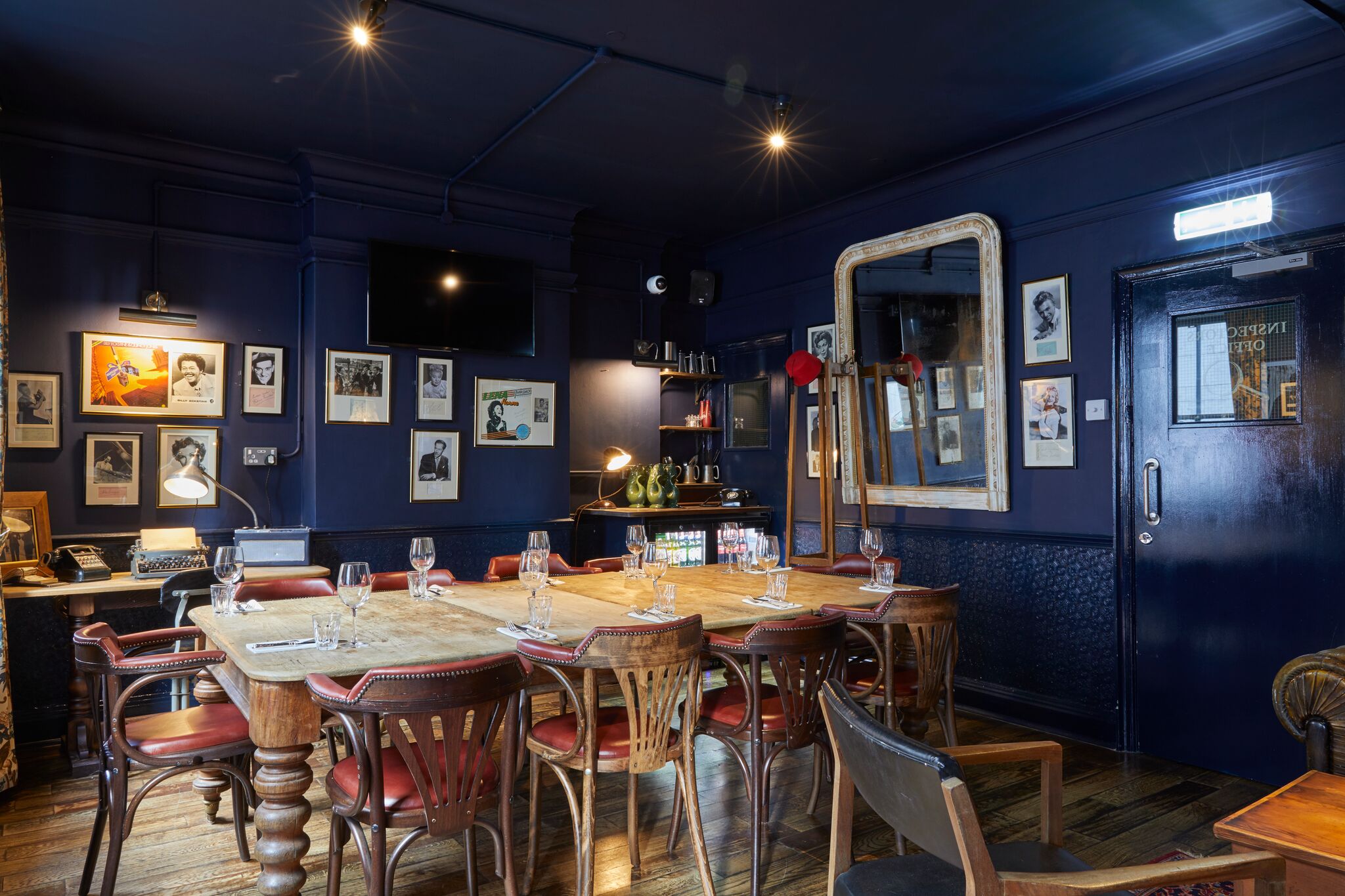 Intimate meeting space in Bow Street Tavern with vintage decor, ideal for gatherings.
