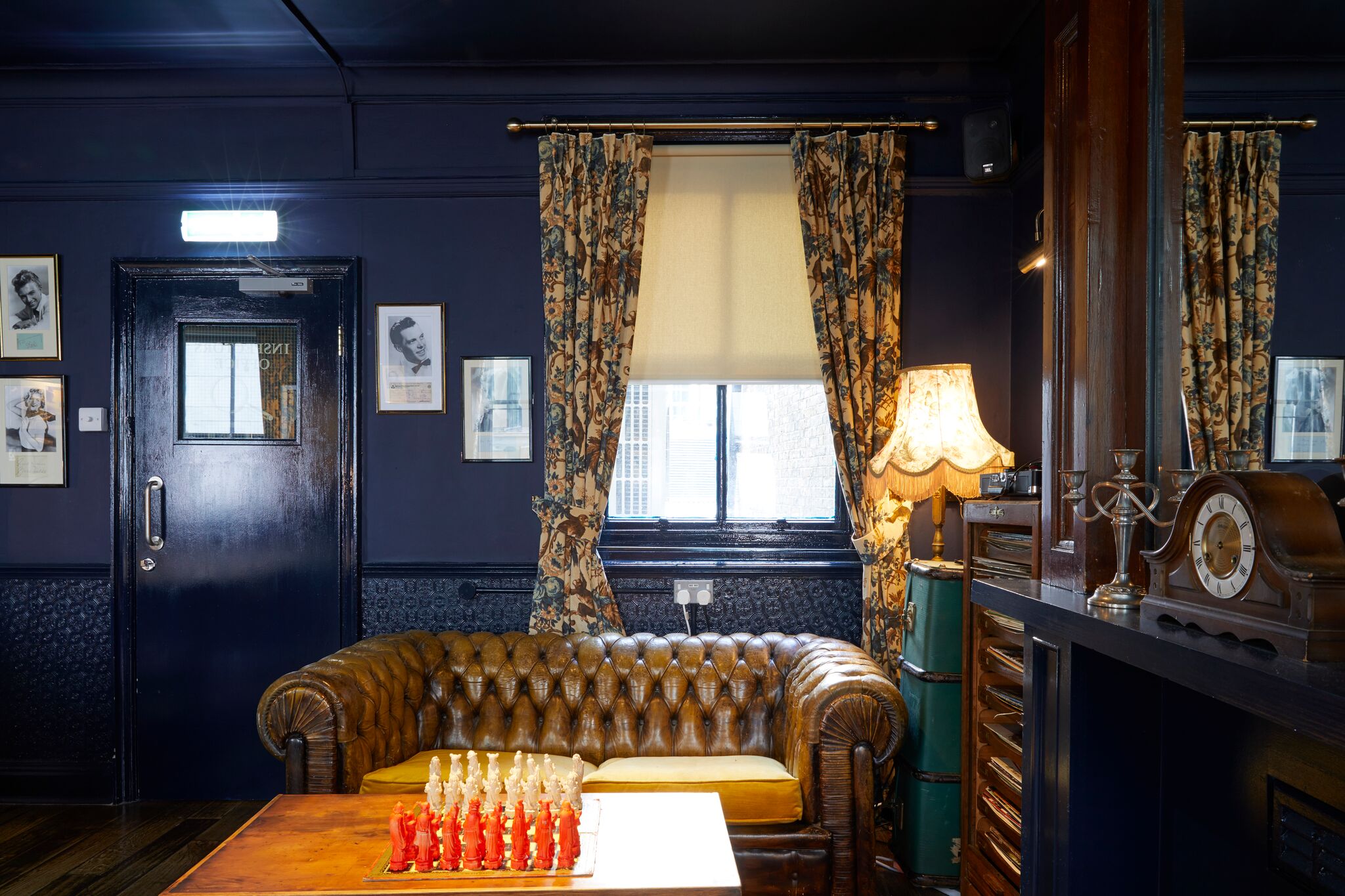 Intimate meeting space with leather sofa at Bow Street Tavern, perfect for creative gatherings.
