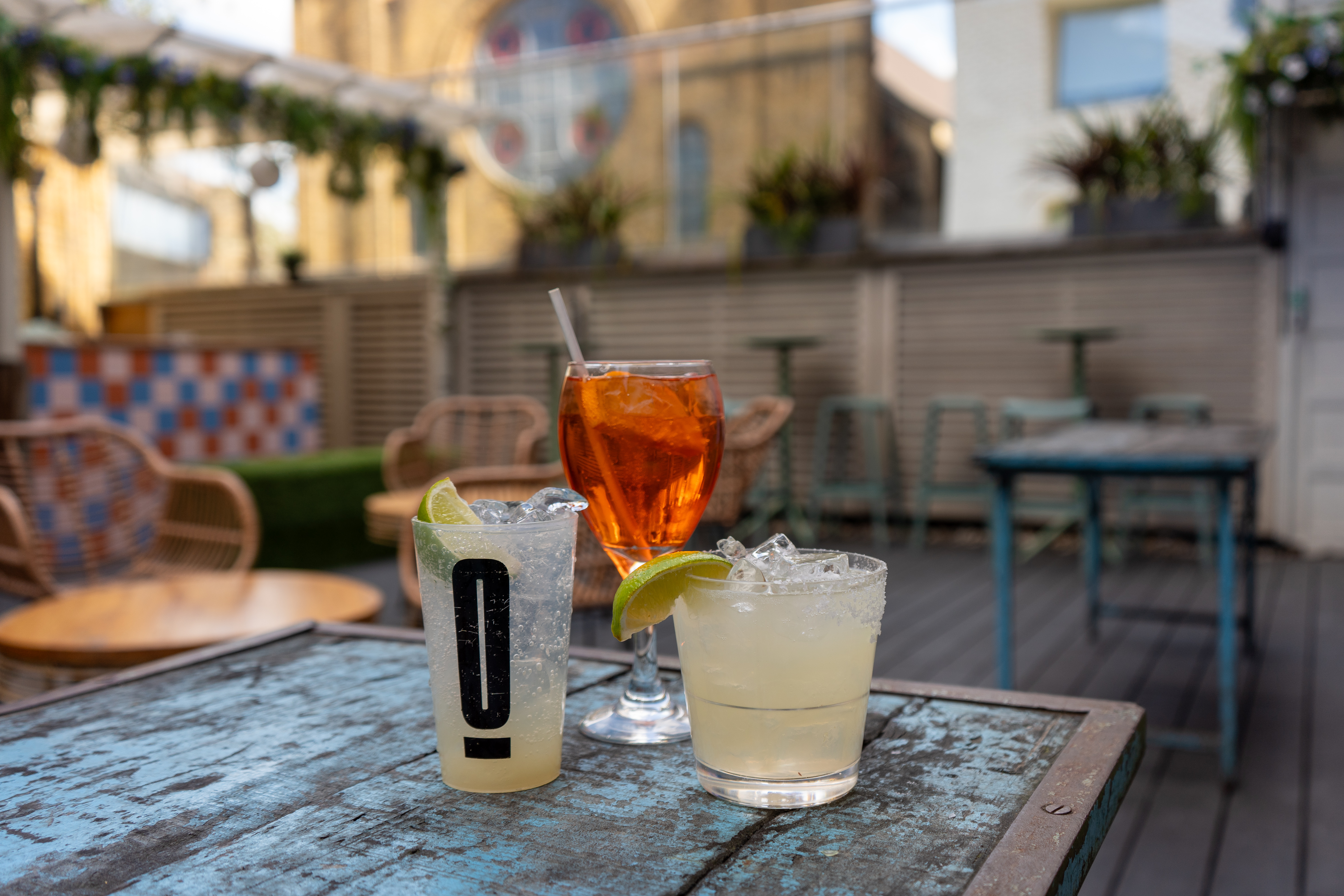 Stylish outdoor seating at Omeara with cocktails for networking events and gatherings.