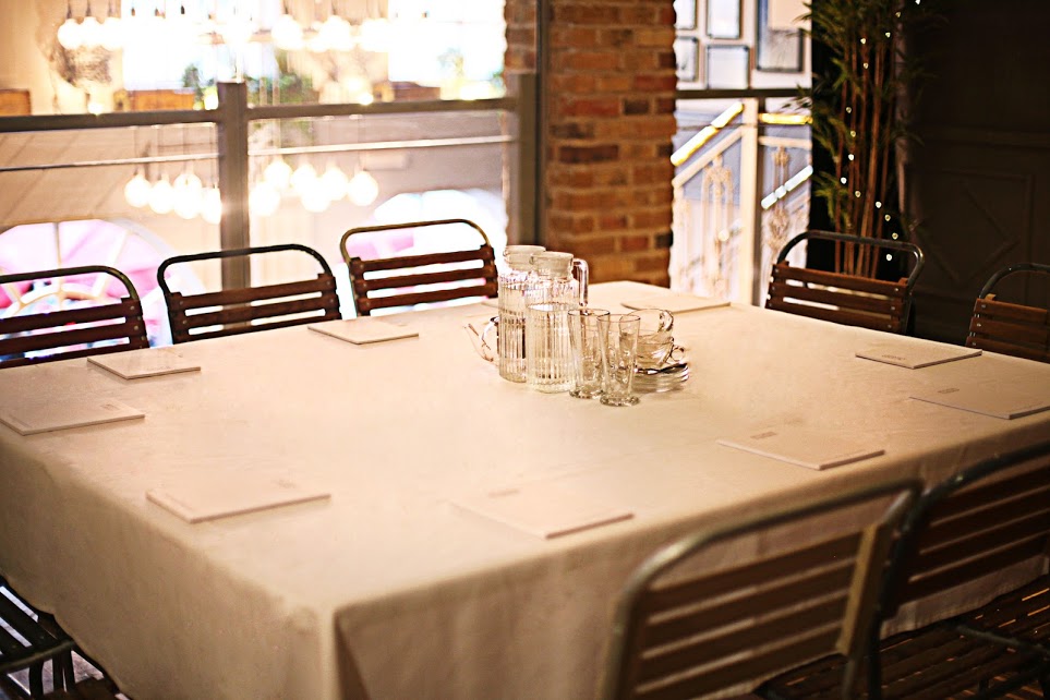 "Elegant meeting table setup in Actress and Bishop for intimate discussions."