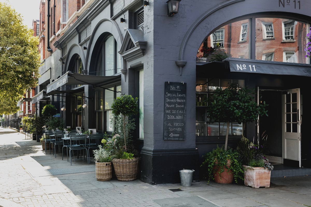 Private dining room with outdoor seating, ideal for casual meetings and networking events.