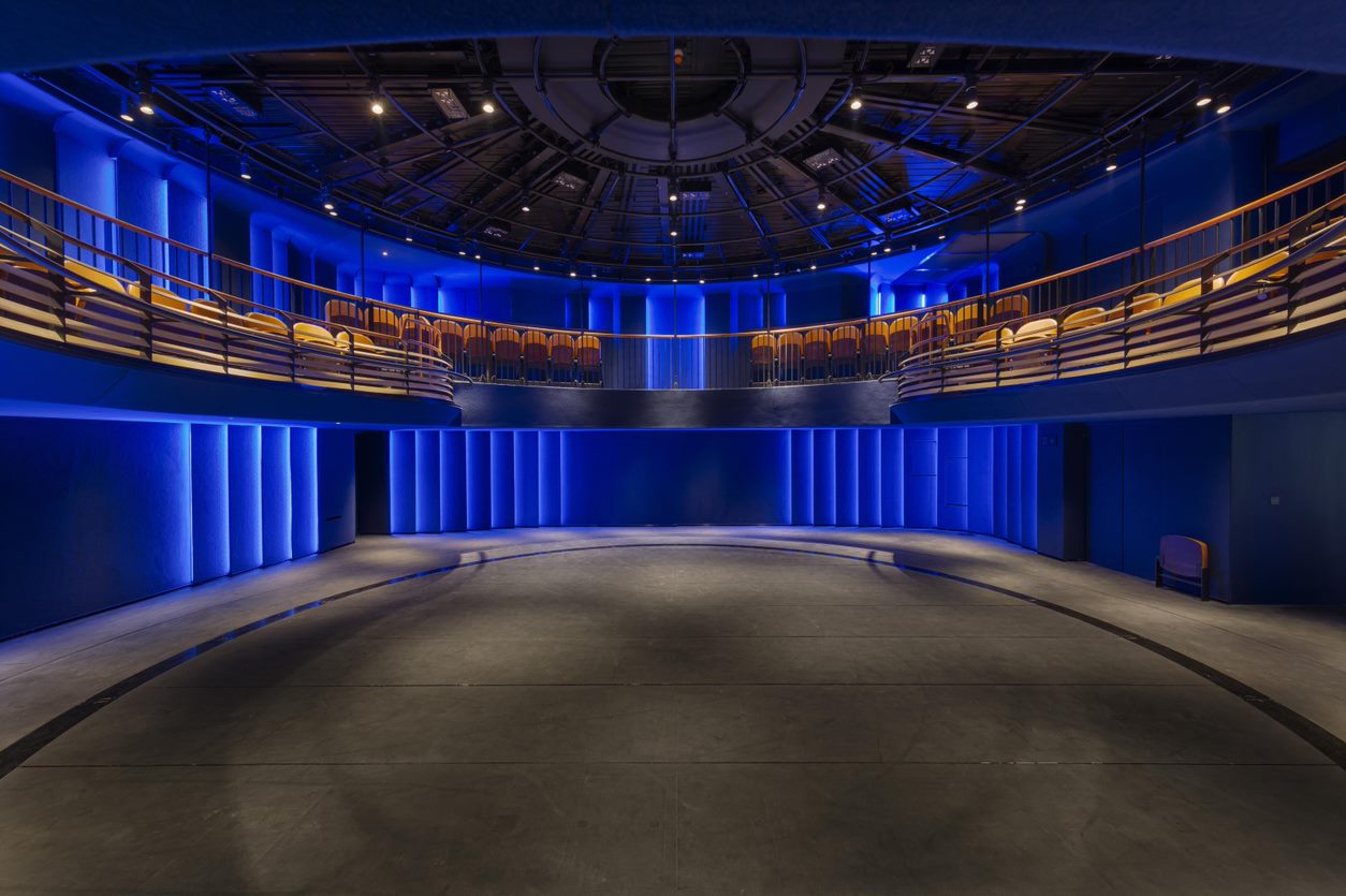 Modern circular auditorium with tiered seating for events and presentations.