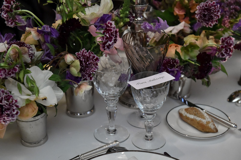 Elegant table setting with floral arrangements for upscale events at Maison Assouline.