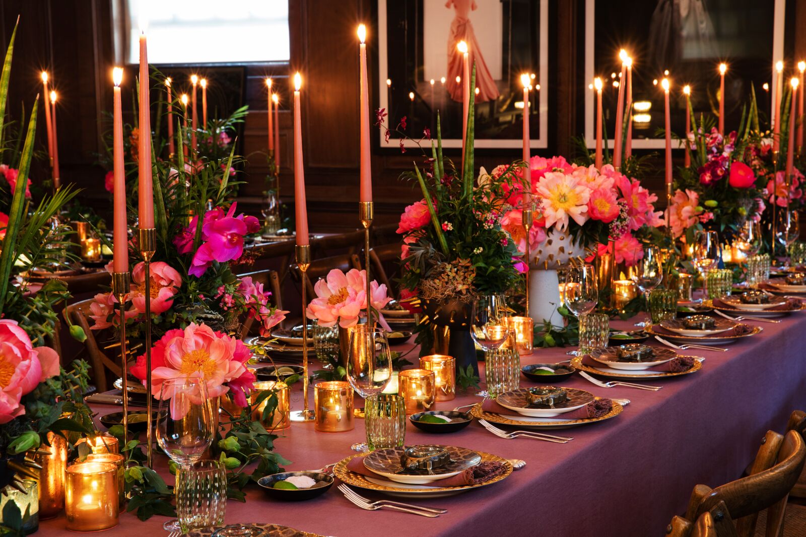 Elegant banquet table with floral centerpieces for upscale gala or dinner party.