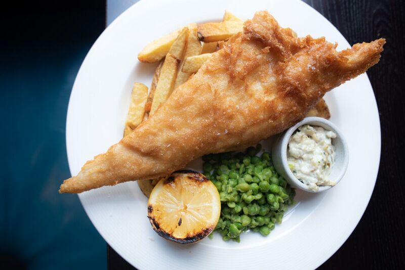 Fish and chips with golden batter, perfect for local cuisine events and casual dining.