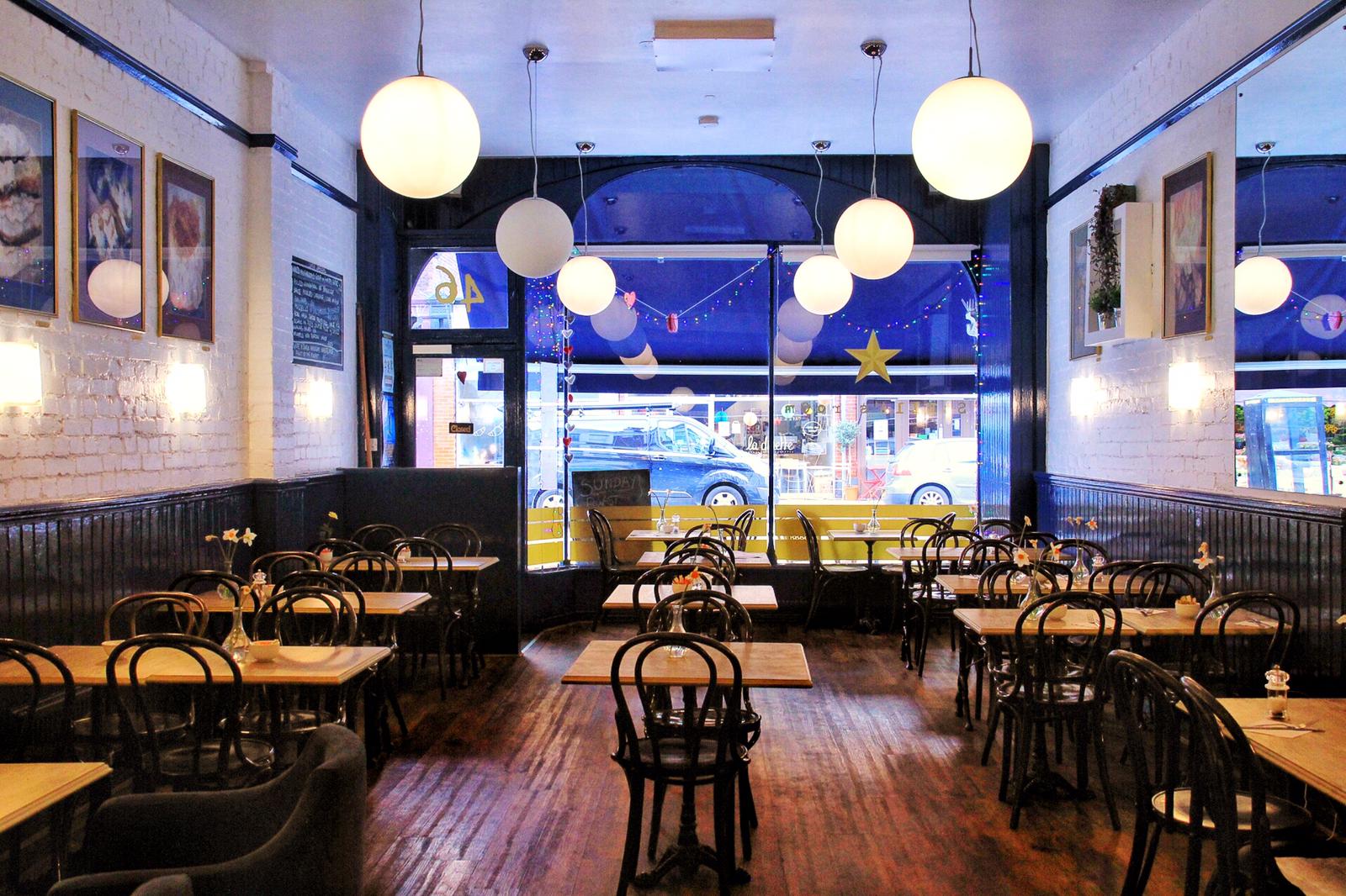 Cozy ground floor restaurant with wooden floors, ideal for intimate gatherings and meetings.