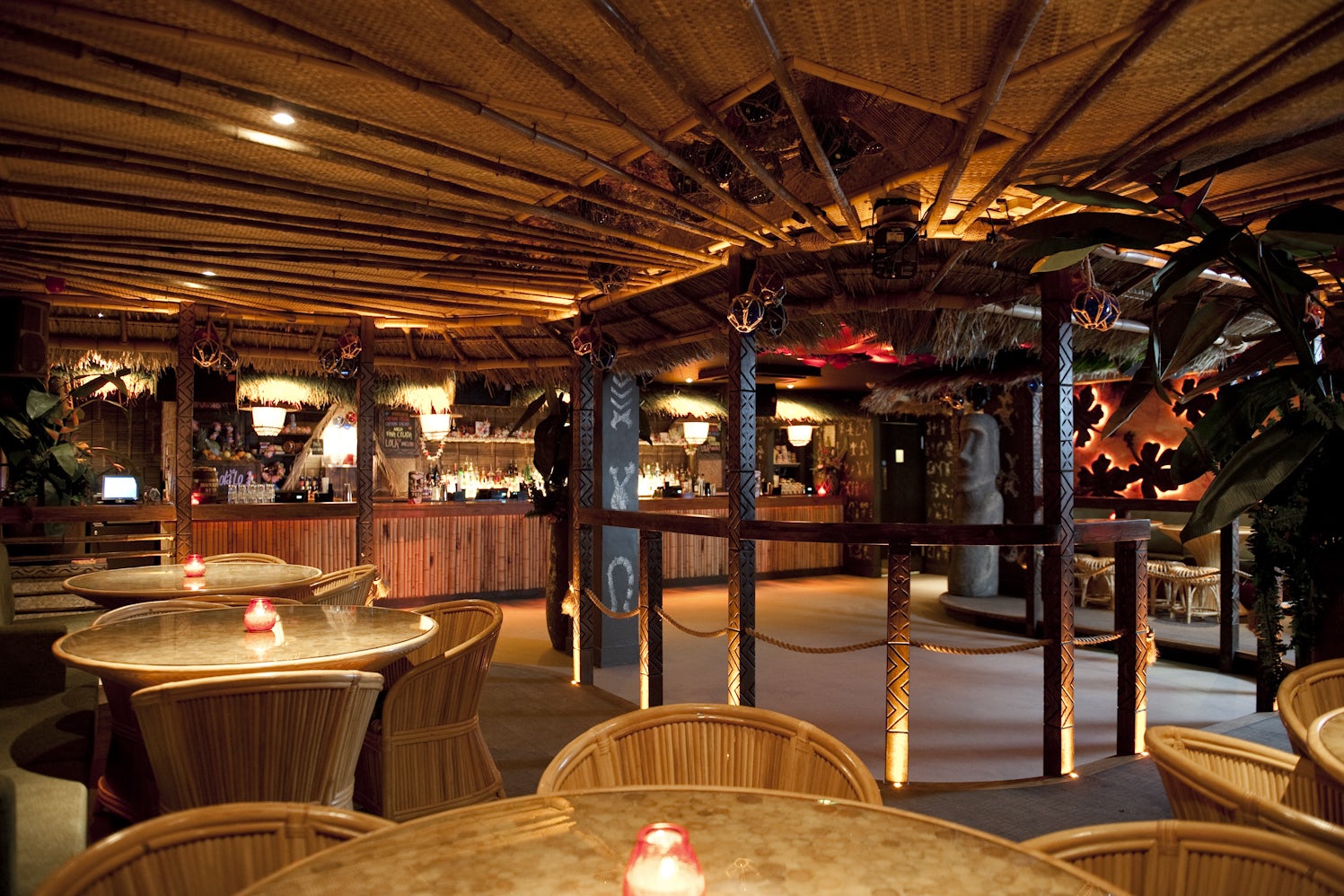 Vibrant tropical venue with bamboo decor for unique events and gatherings.