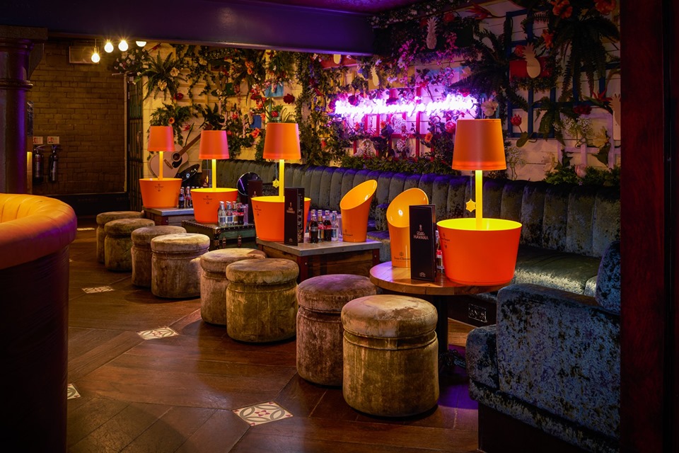 Vibrant Little Havana event space with colorful seating for networking and receptions.