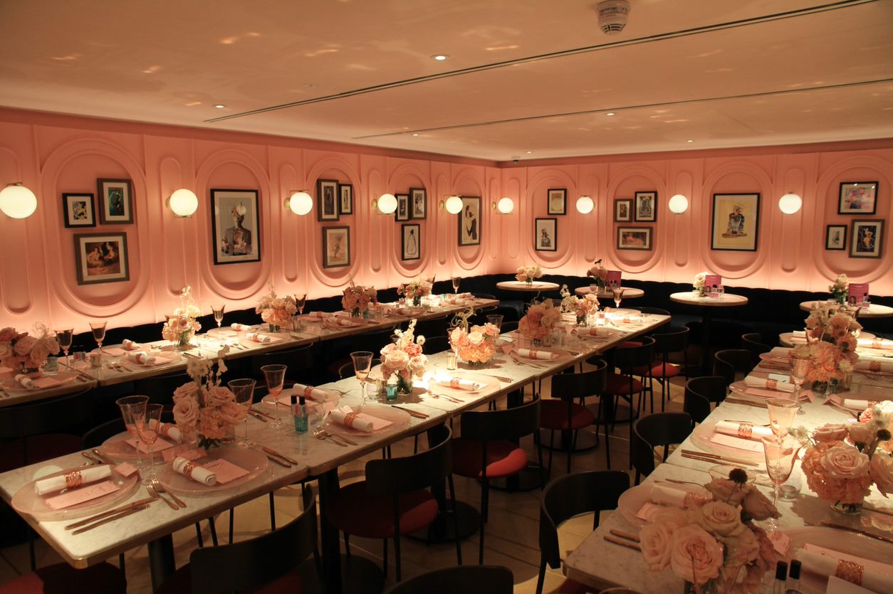 Elegant event space with pink walls for upscale dinners and gatherings in The Boulevard.