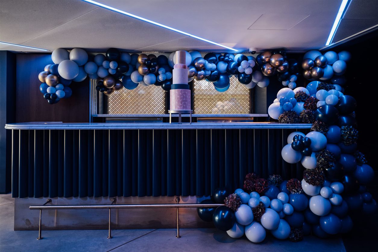 Stylish Stalls Lounge with balloon installation, ideal for upscale events and receptions.