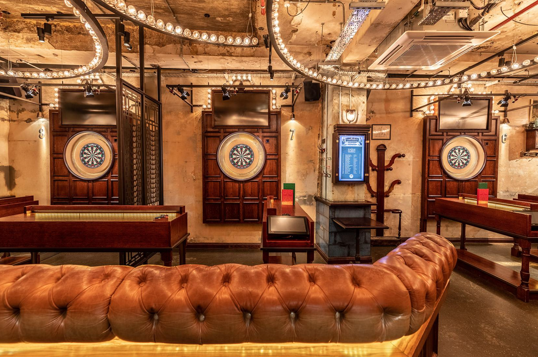 Stylish event space with leather seating for team-building and social mixers.