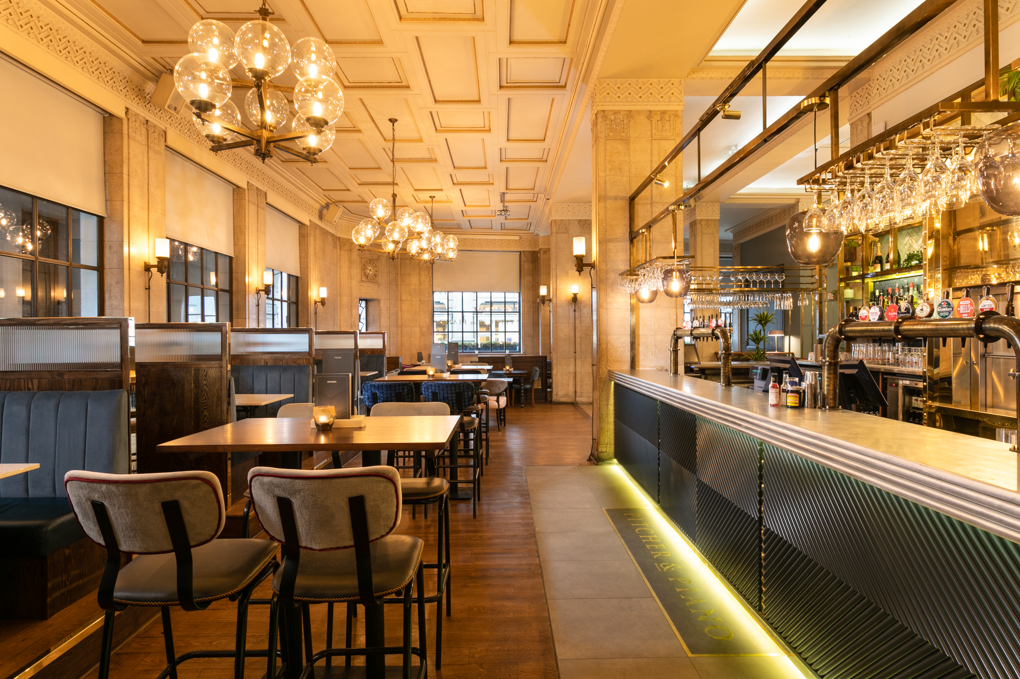 Stylish venue with warm lighting for intimate meetings and social events at Pitcher & Piano.