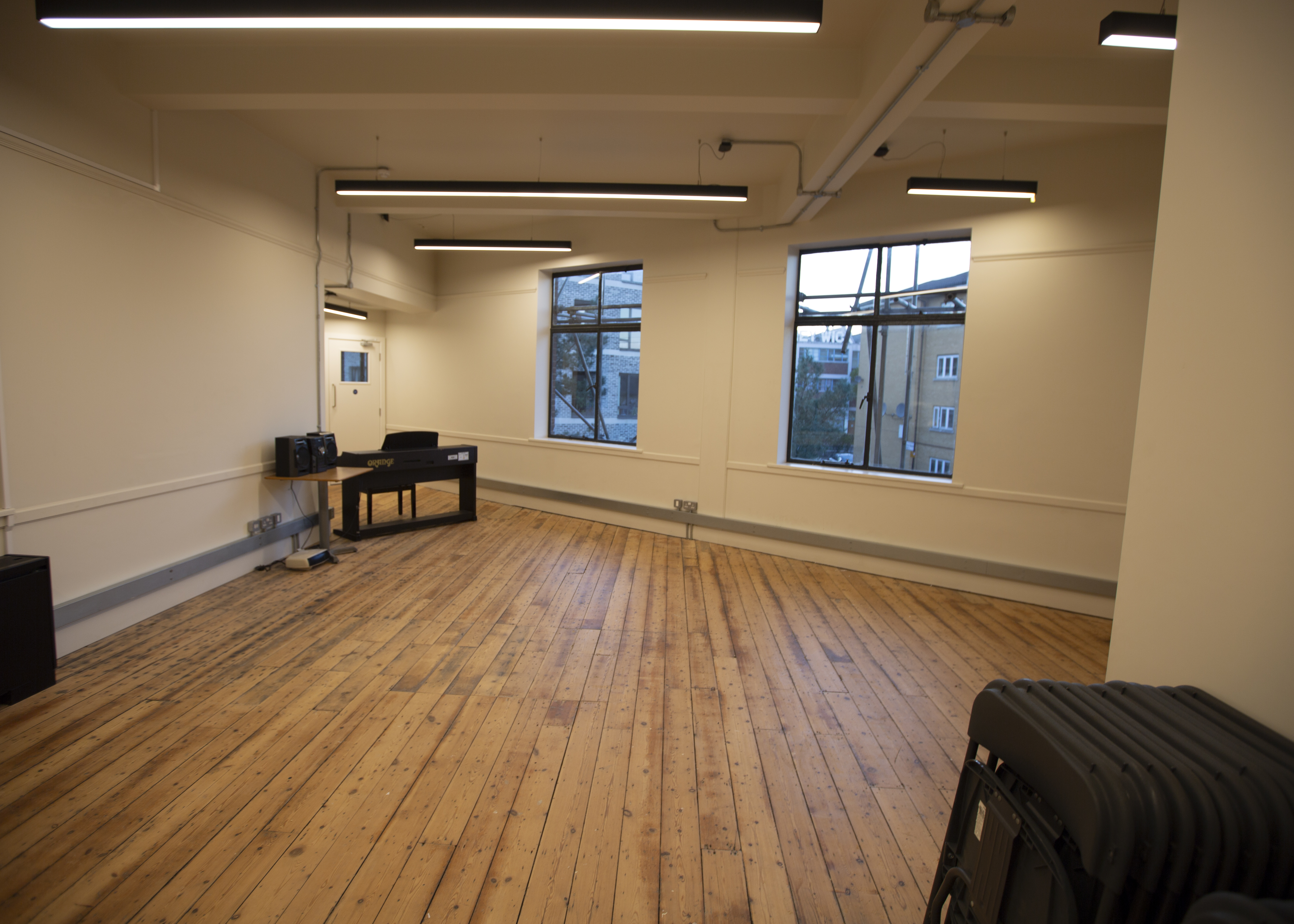 Versatile event space with wooden flooring at The International College of Musical Theatre.