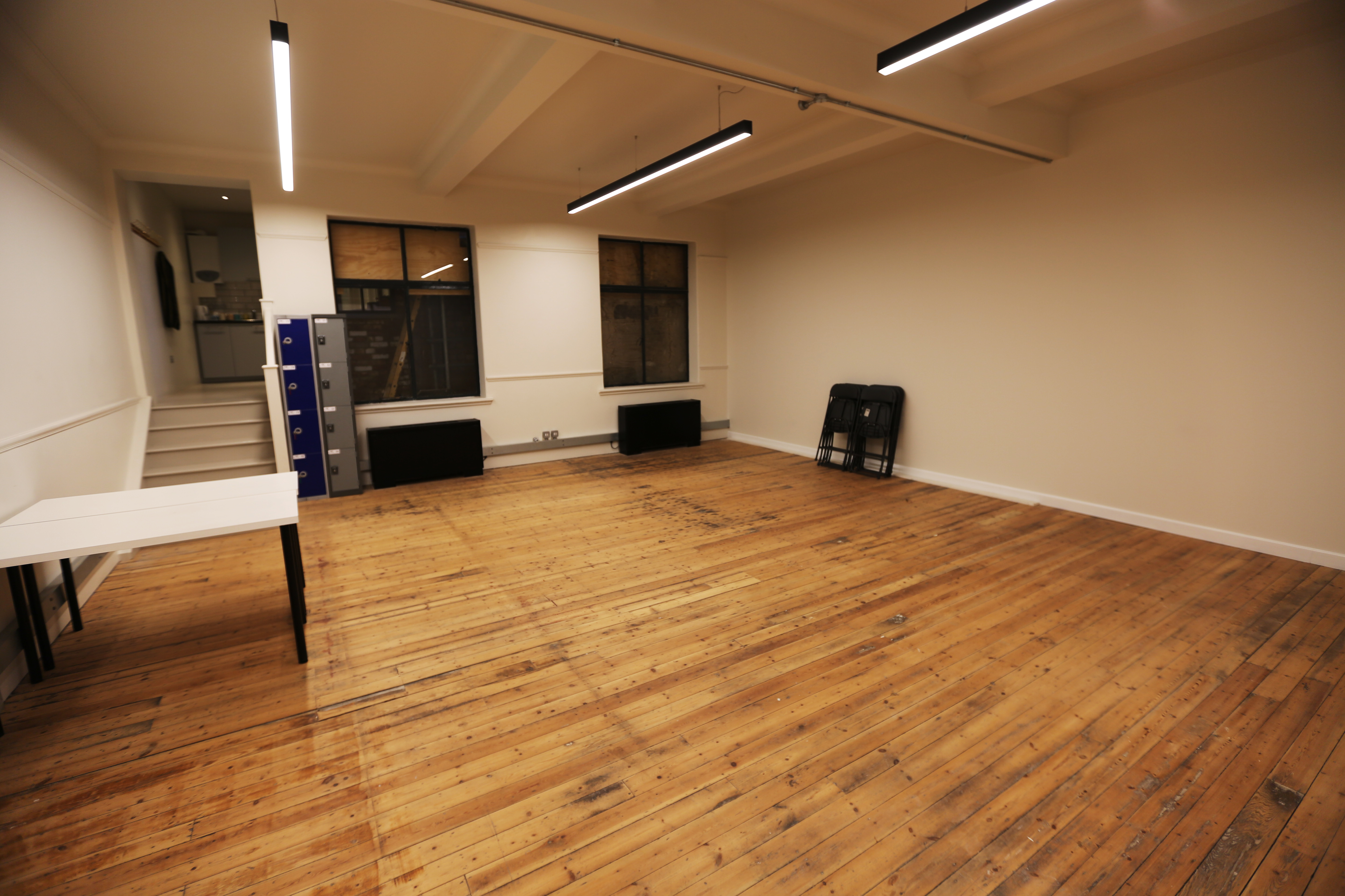 Versatile event space with wooden floor at International College of Musical Theatre.