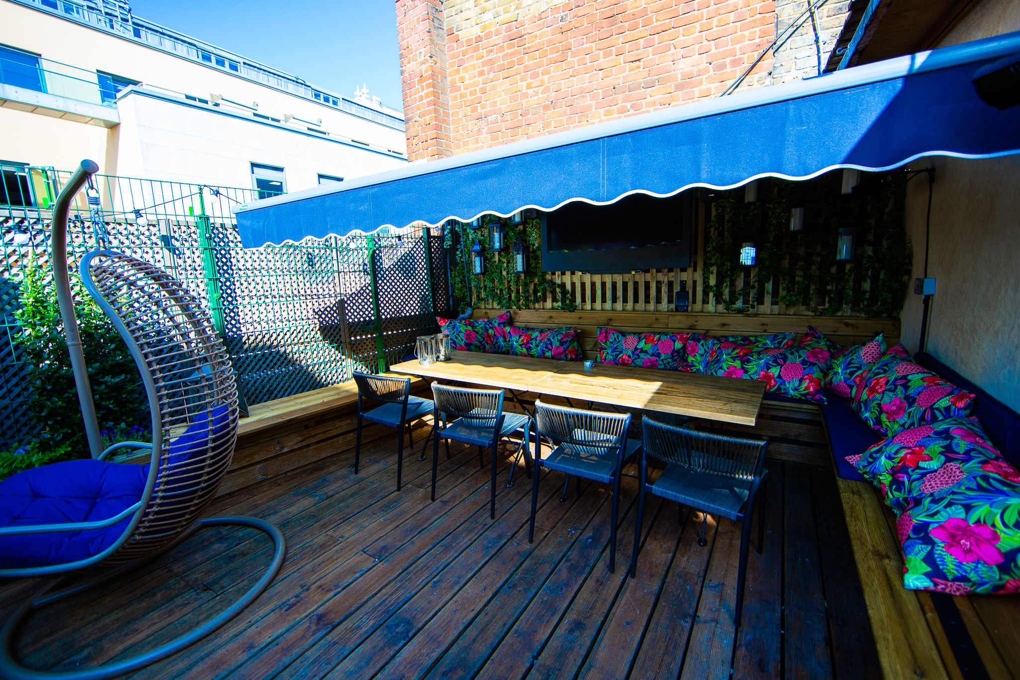 Outdoor meeting space at Bow Street Tavern with colorful cushions for casual gatherings.
