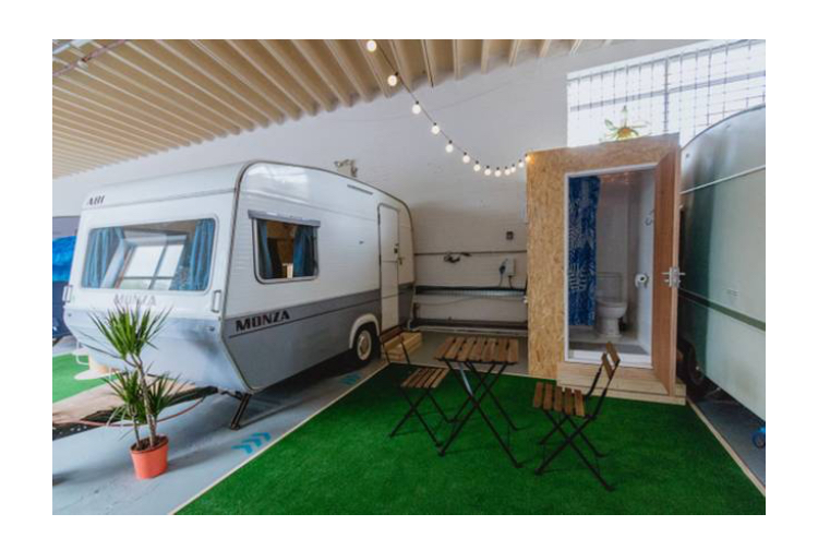 Vintage caravan event space for casual meetings and networking in Towed Town Camping.