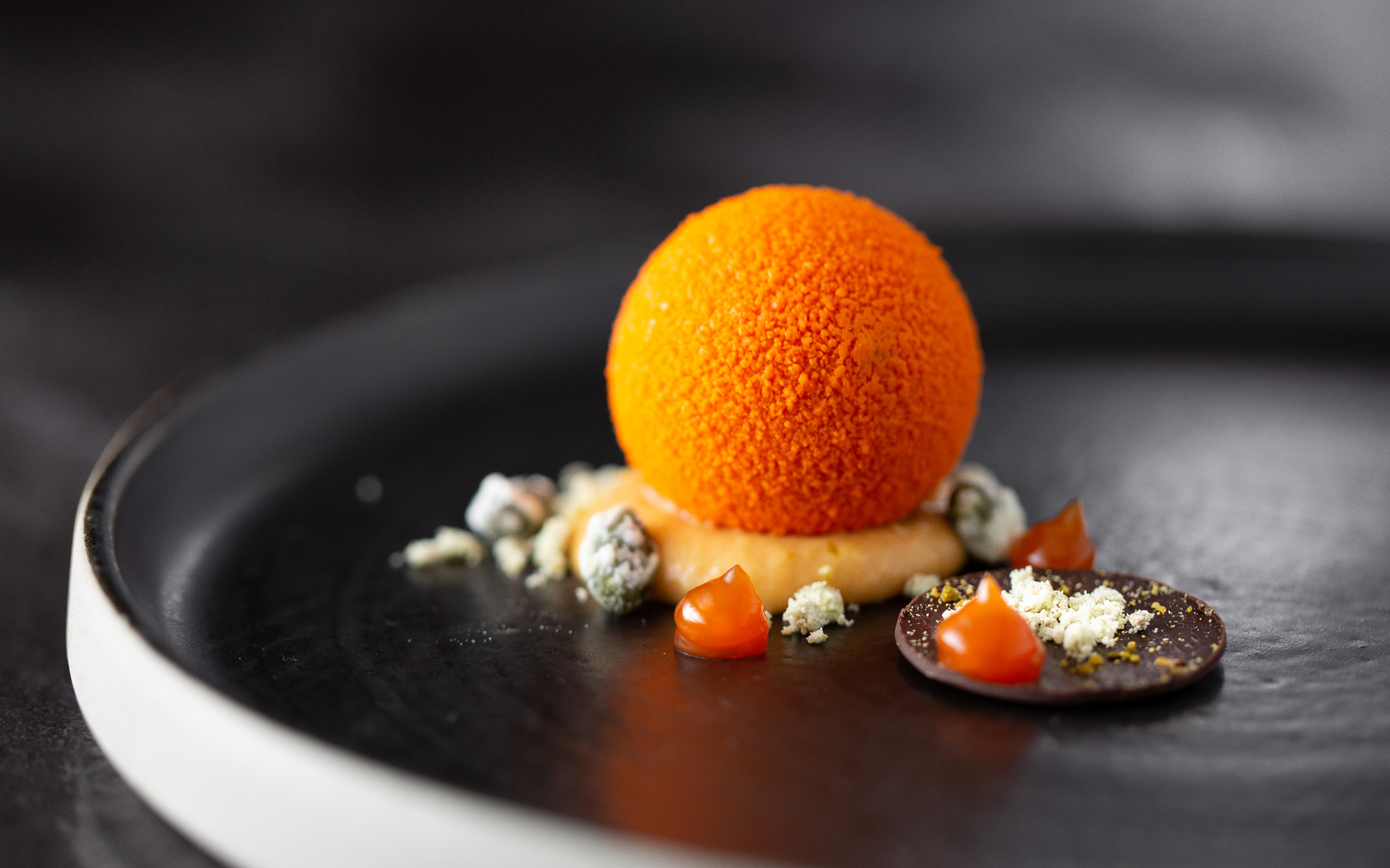 Elegant orange dessert sphere at Sequoia, Rockliffe Hall for upscale events.