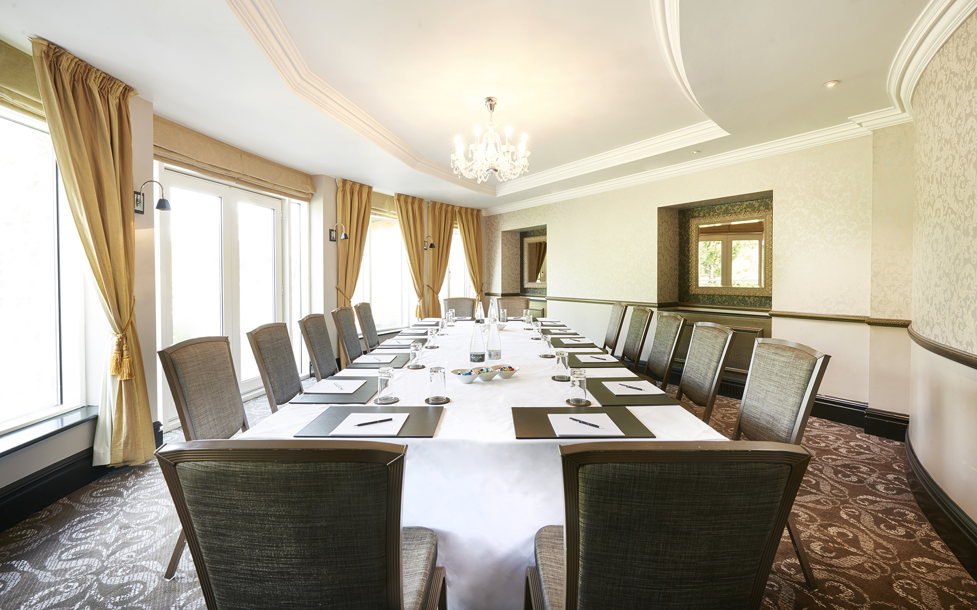 Elegant meeting room at Rockliffe Hall with chandelier, ideal for corporate events.