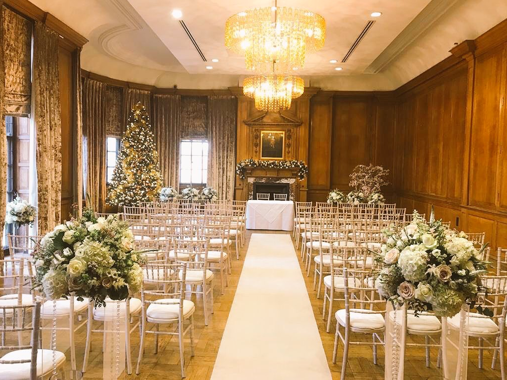 Grand Boardroom at The Grand, York: elegant wedding venue with floral decor and festive tree.