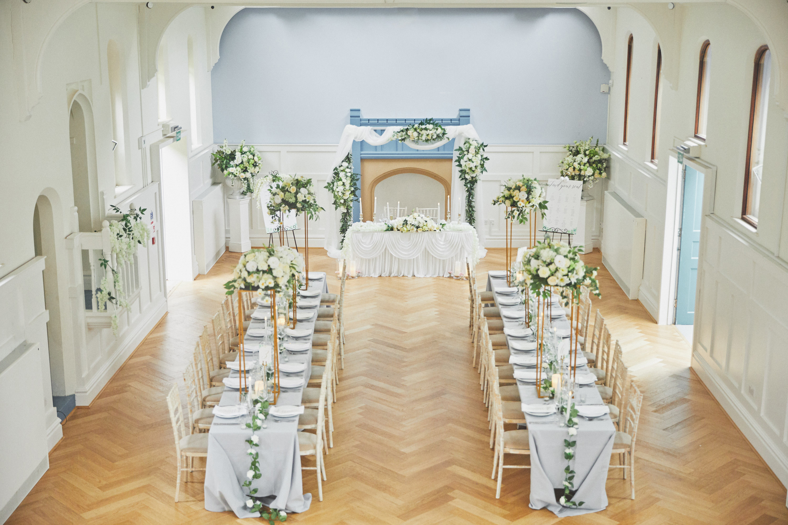 Byculla Suite in Ashburton Hall, elegant wedding venue with floral centerpieces.