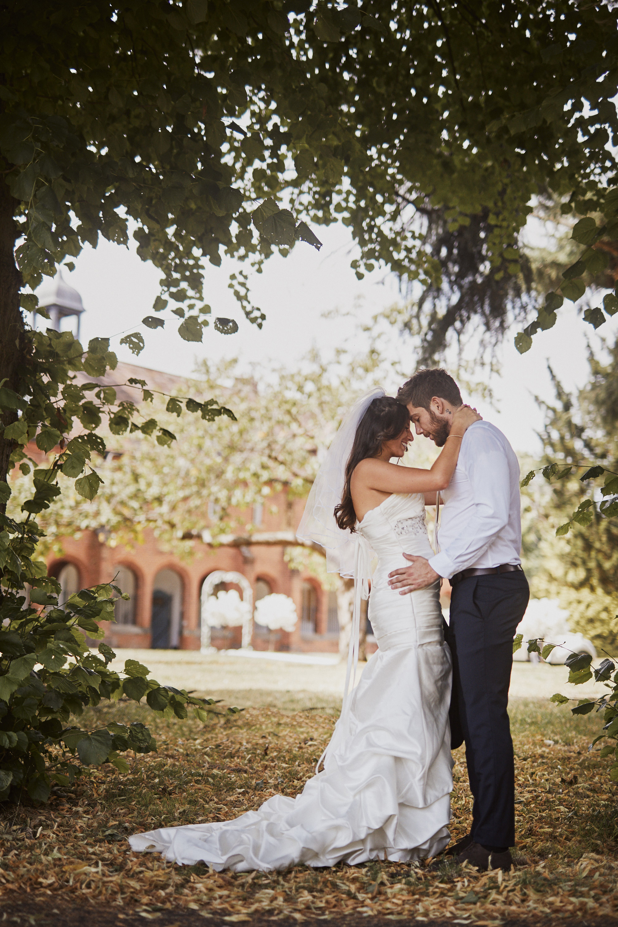 Couple in Byculla Suite, Ashburton Hall - romantic wedding venue with lush greenery.