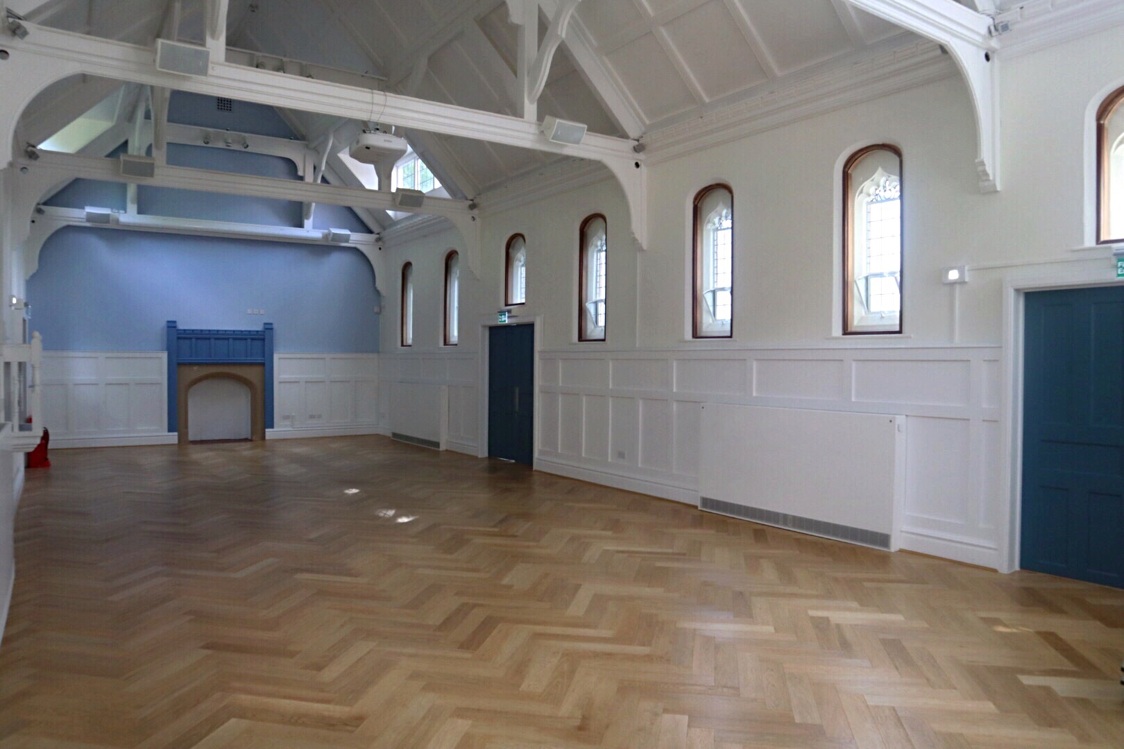 Byculla Suite in Ashburton Hall: spacious event venue with high ceilings for meetings and workshops.