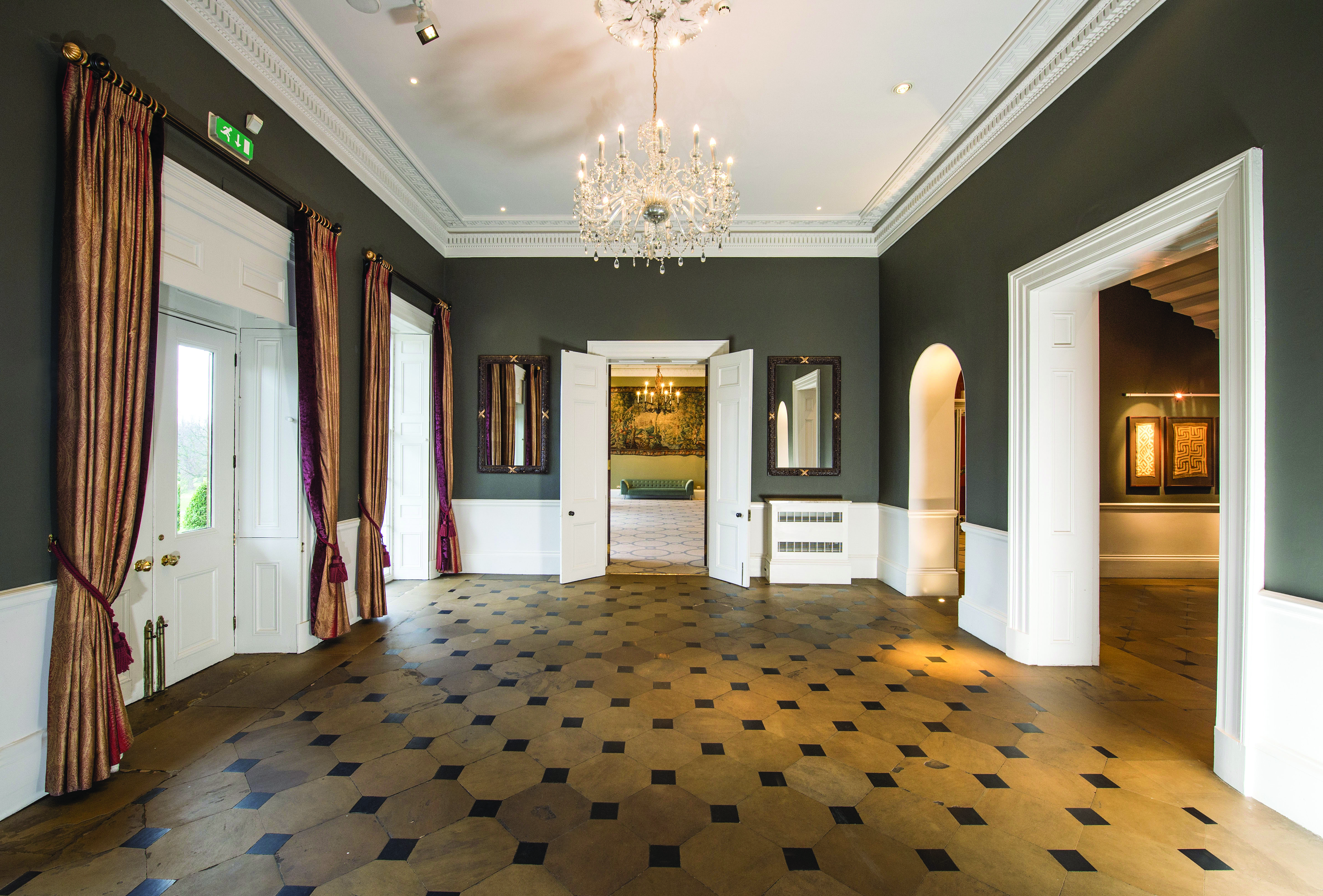 Elegant event space in Rudding Park Library with chandelier, ideal for meetings and receptions.